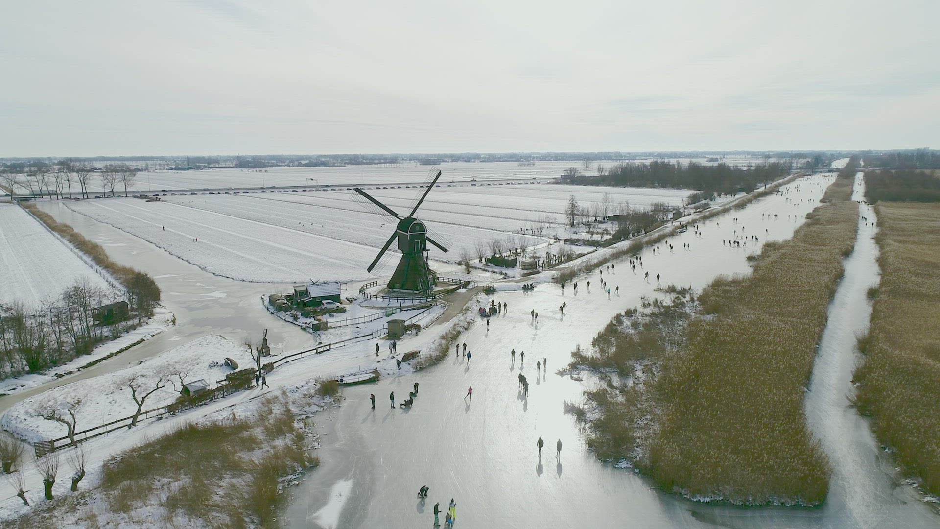 People ice skating on frozen river, Lexmond, Utrecht, Netherlands
