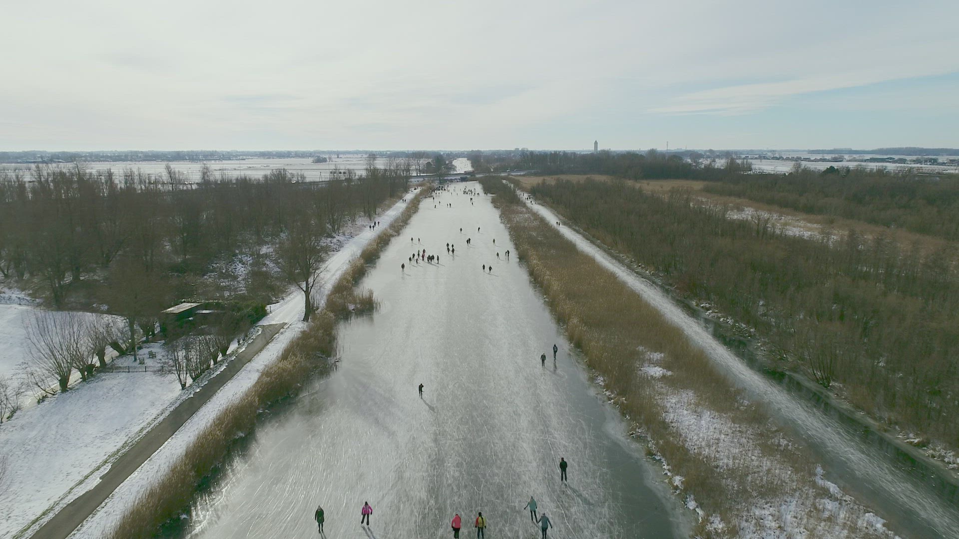 People ice skating on frozen river, Lexmond, Utrecht, Netherlands