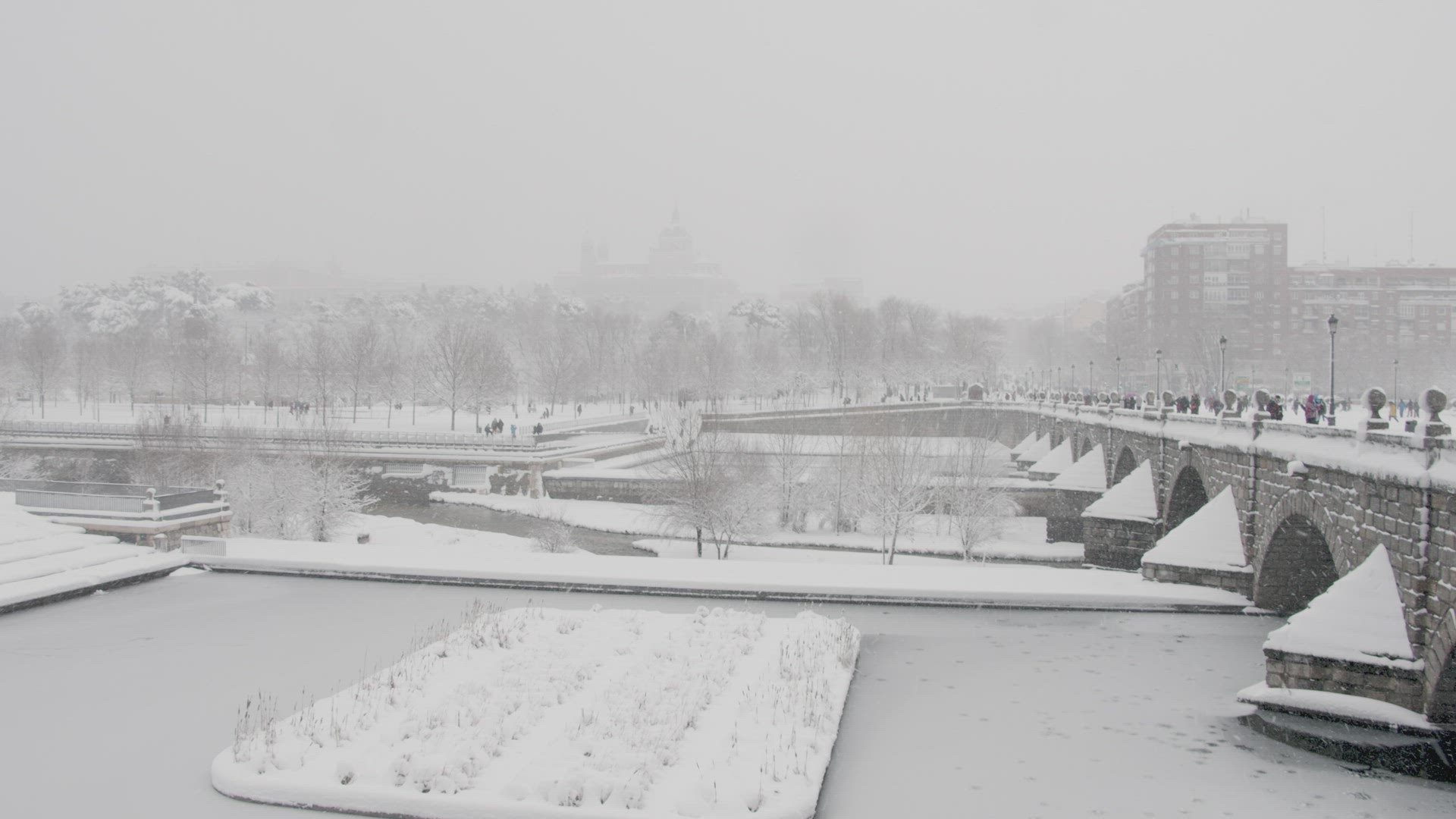 Blizzard in the city river