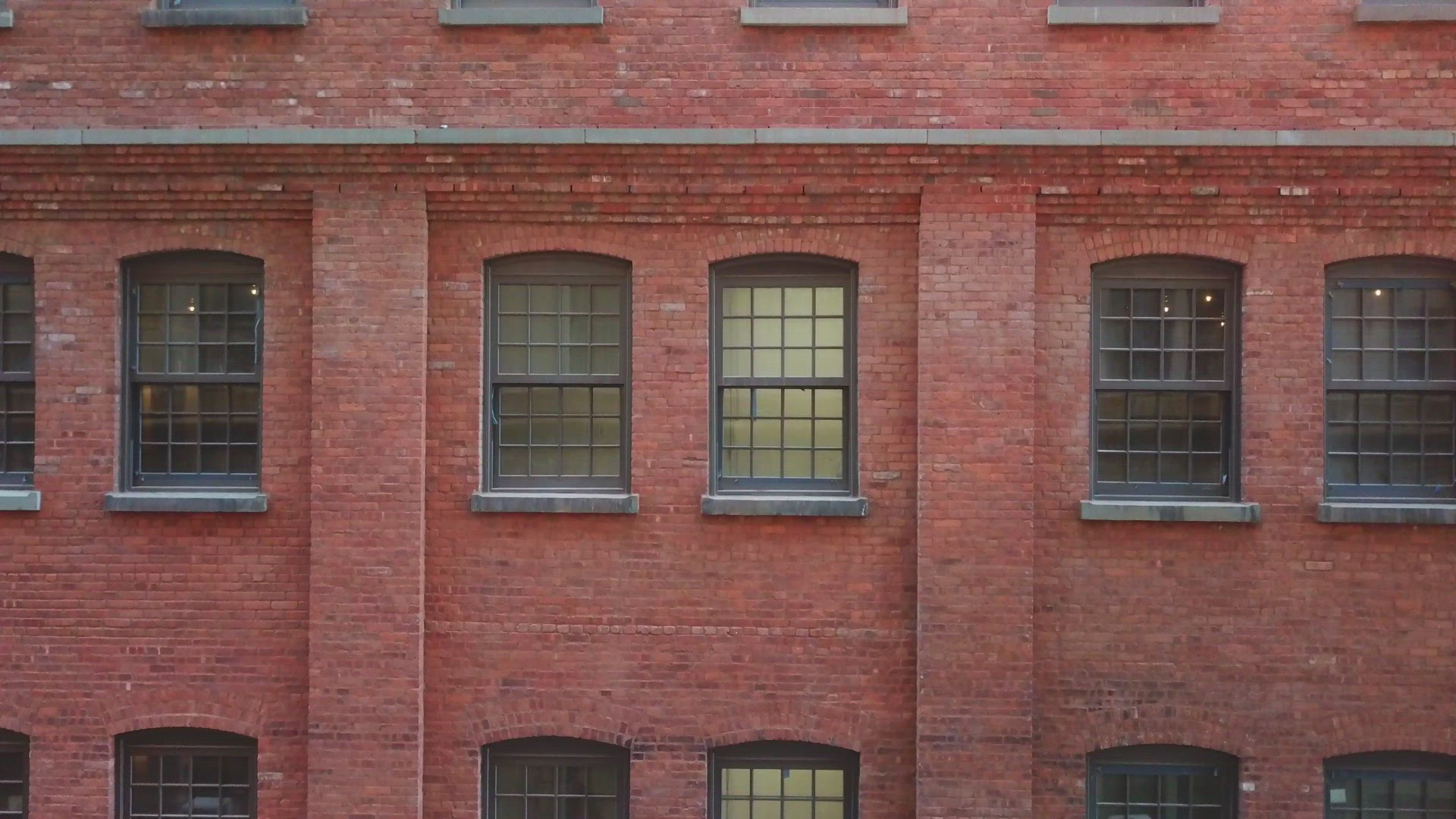 Close Up Descending Crane Shot of a Brick Building in Brooklyn
