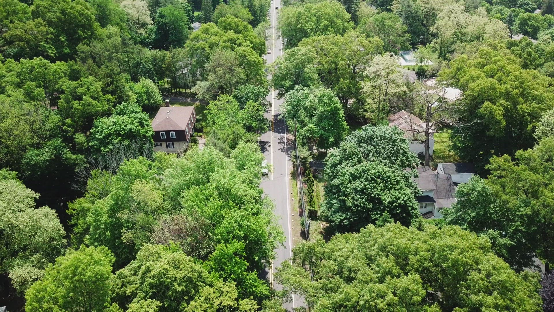 Bird's Eye Camera Tilt of a Suburban Country Road