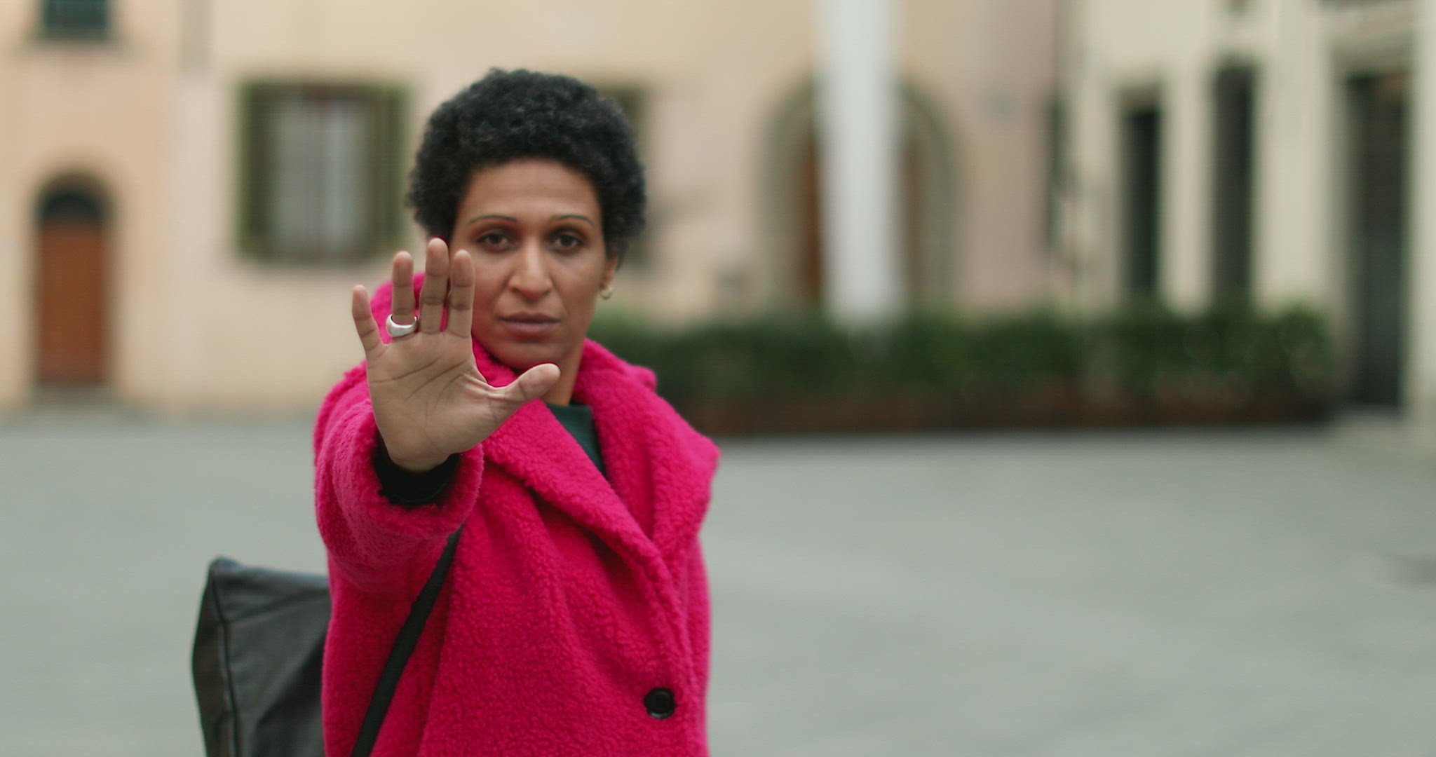 Portrait of woman making stop gesture, Pistoia, Tuscany, Italy