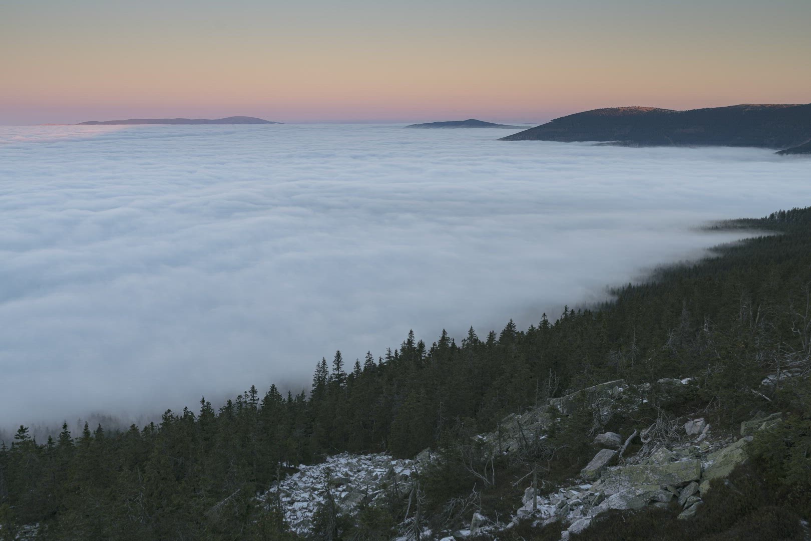 Sunset colours and low clouds above the forest 8K