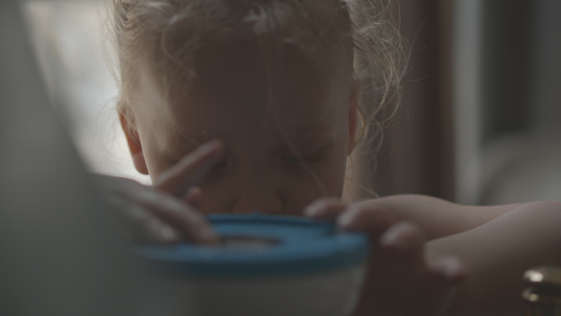 Child exploring interesting things at home