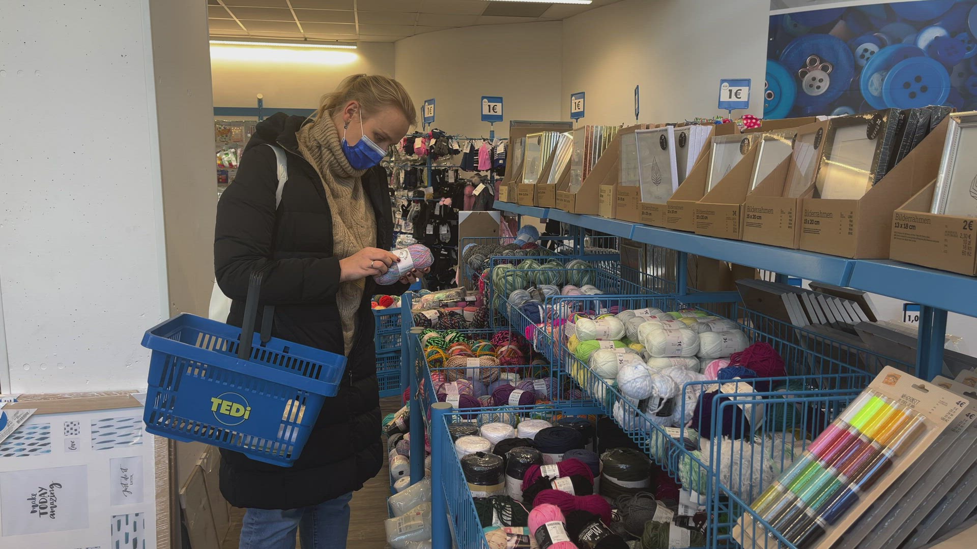Woman doing the shopping in one euro store