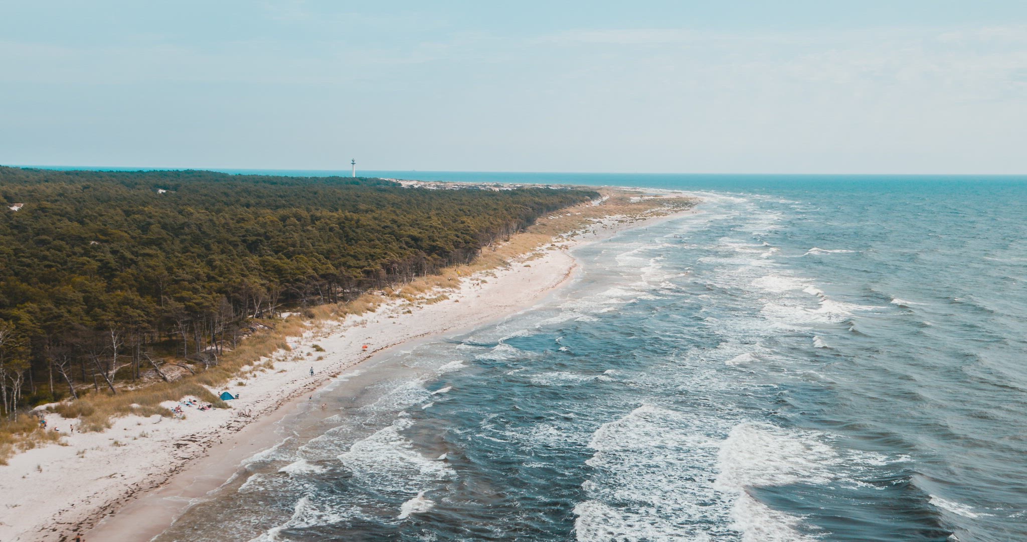 beach coast denmark bornholm seascape waves travel holiday lighthouse dunes foresst aerial 4k