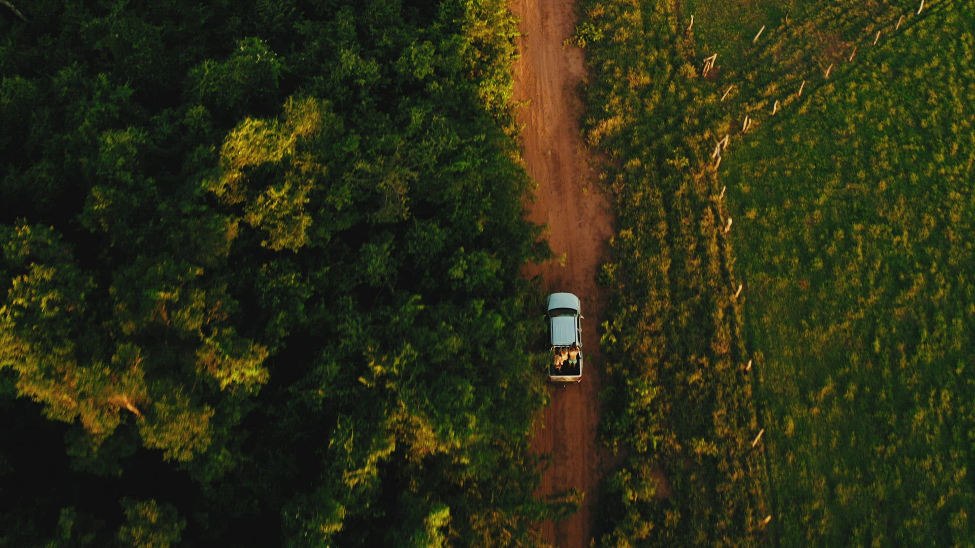 brazil backcountry bush outdoor vw amarok sunset people on back of pickup driving aerial topview 4k