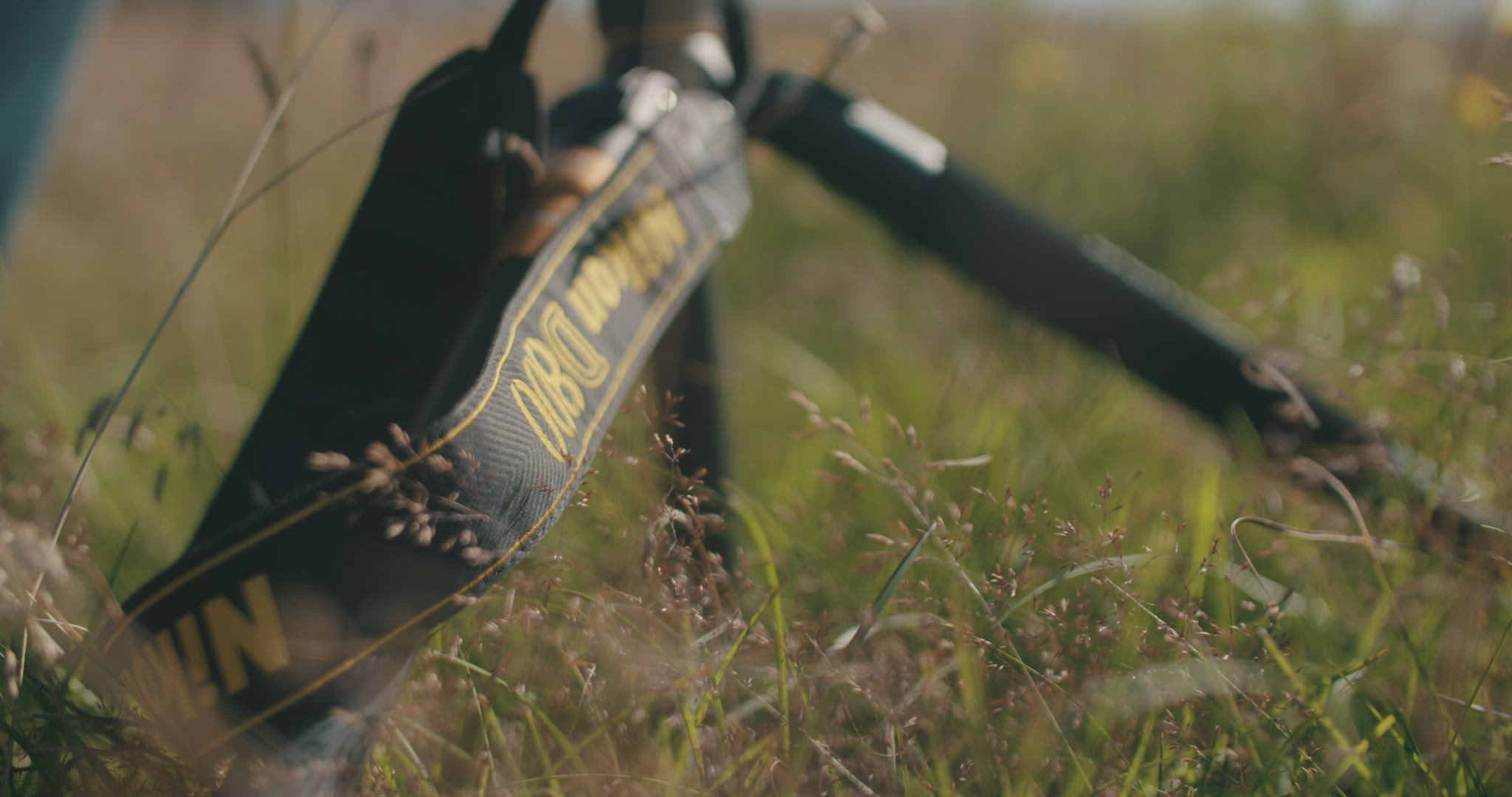 nikon D800 strap close up in high grass 4k