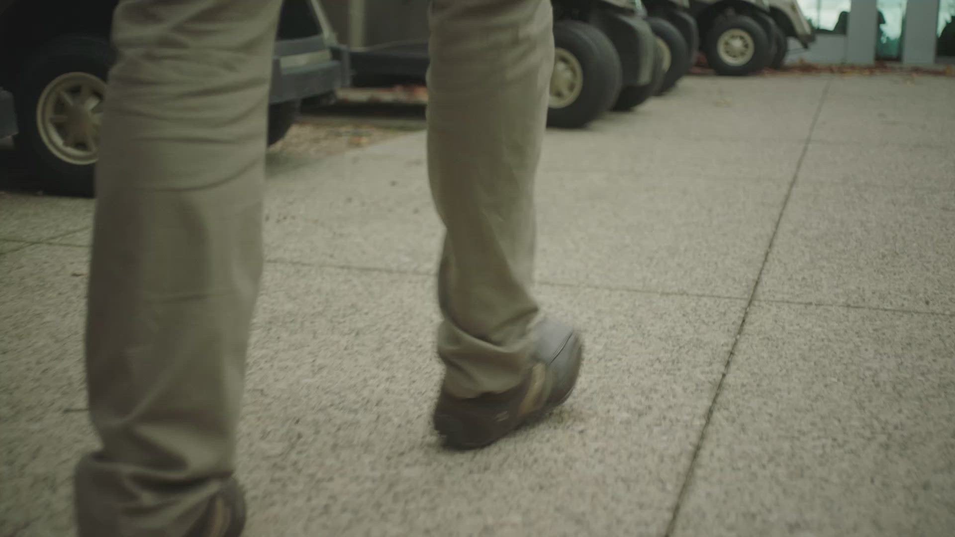 Feet walking as family walk into restaurant 