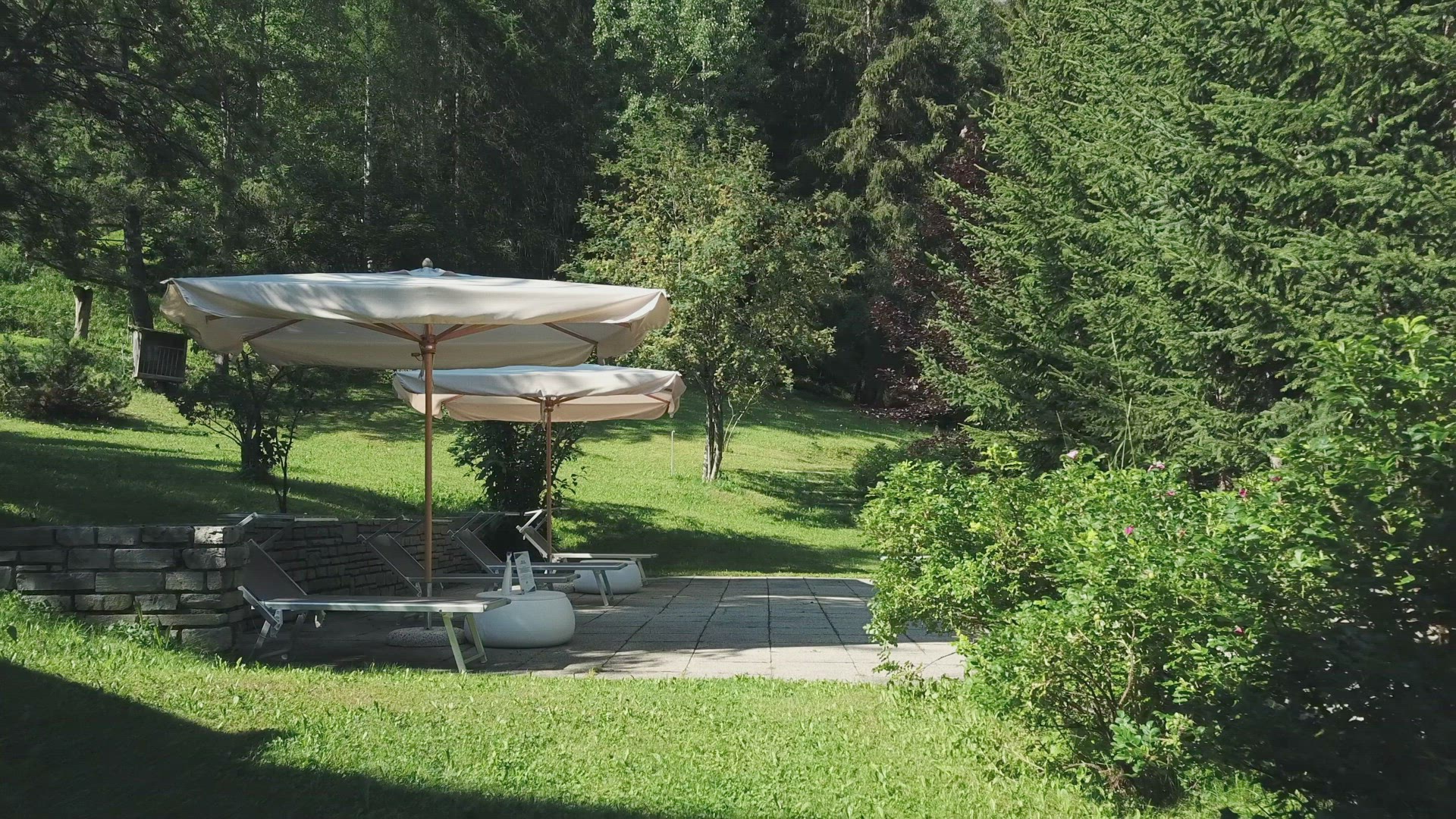 Resort sun shades and sun loungers in landscape, Alta Badia, Italy