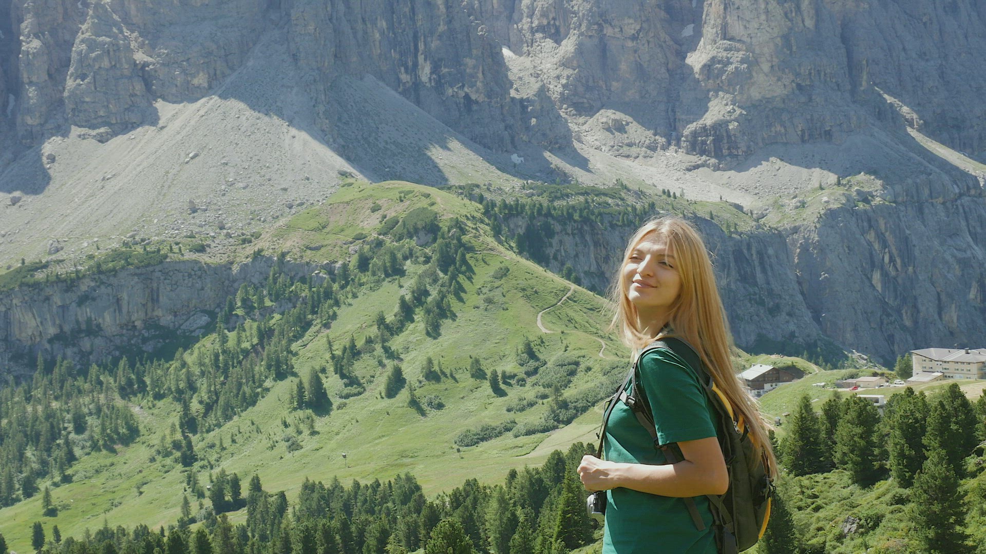 Portrait of young woman in mountain landscape, Alta Badia, Italy