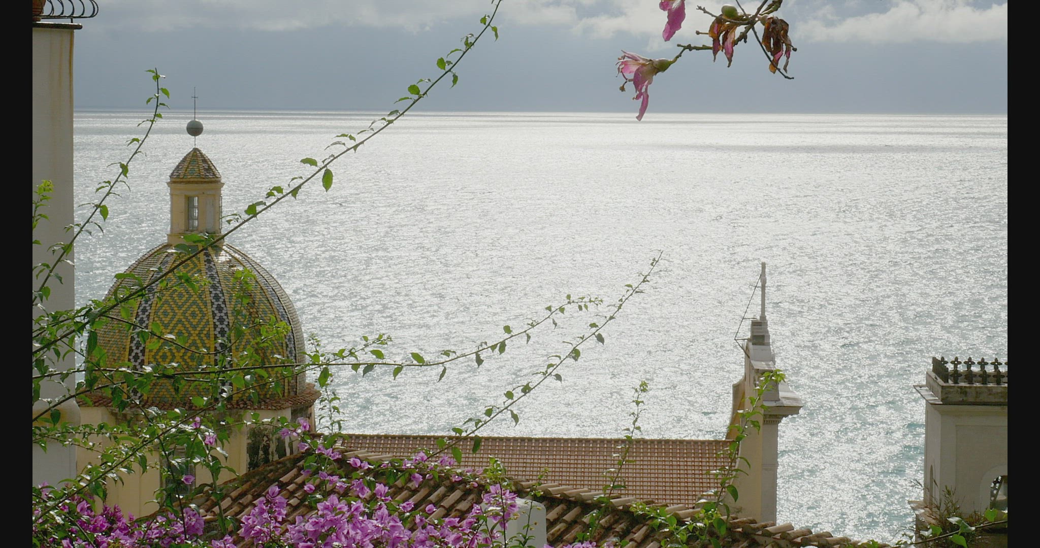 Exterior of church of Santa Maria Assunta and sea, Positano, Italy