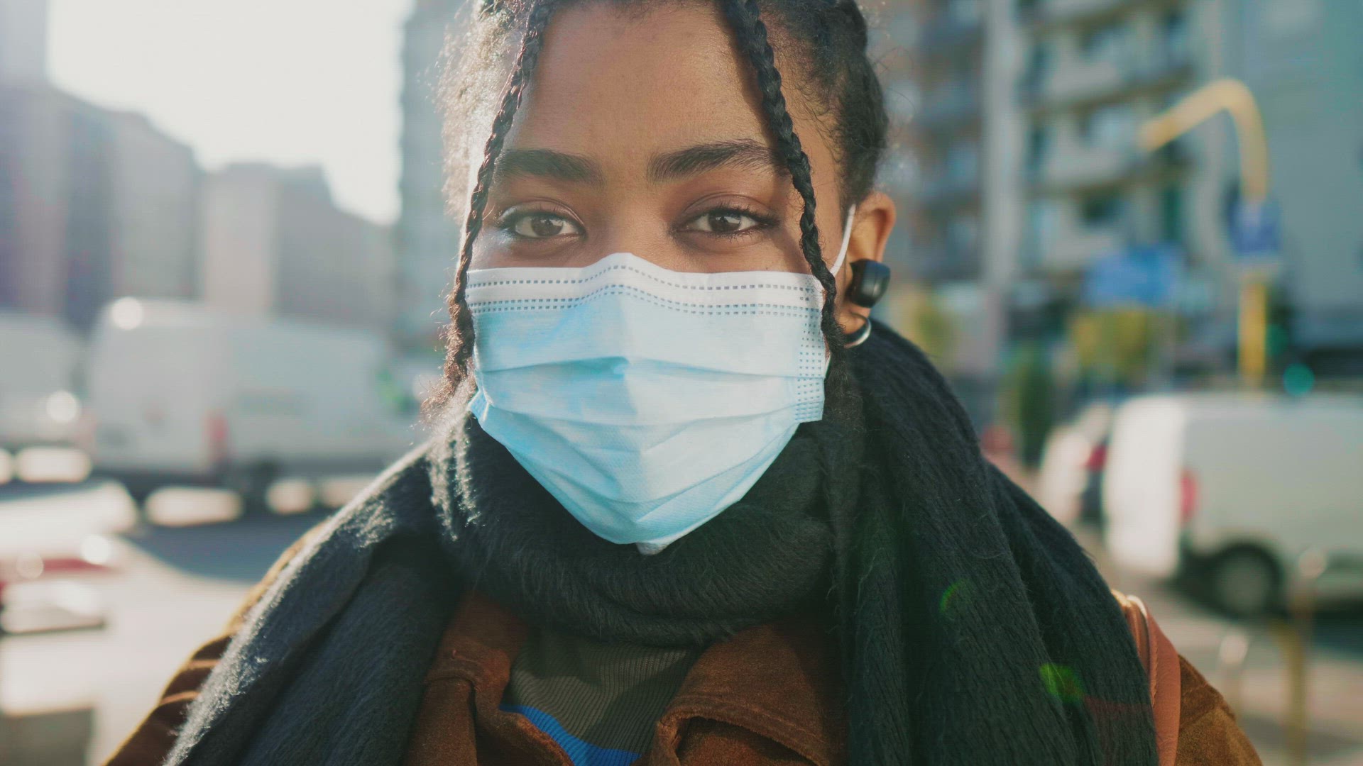 Portrait of young woman in face mask on street, Italy