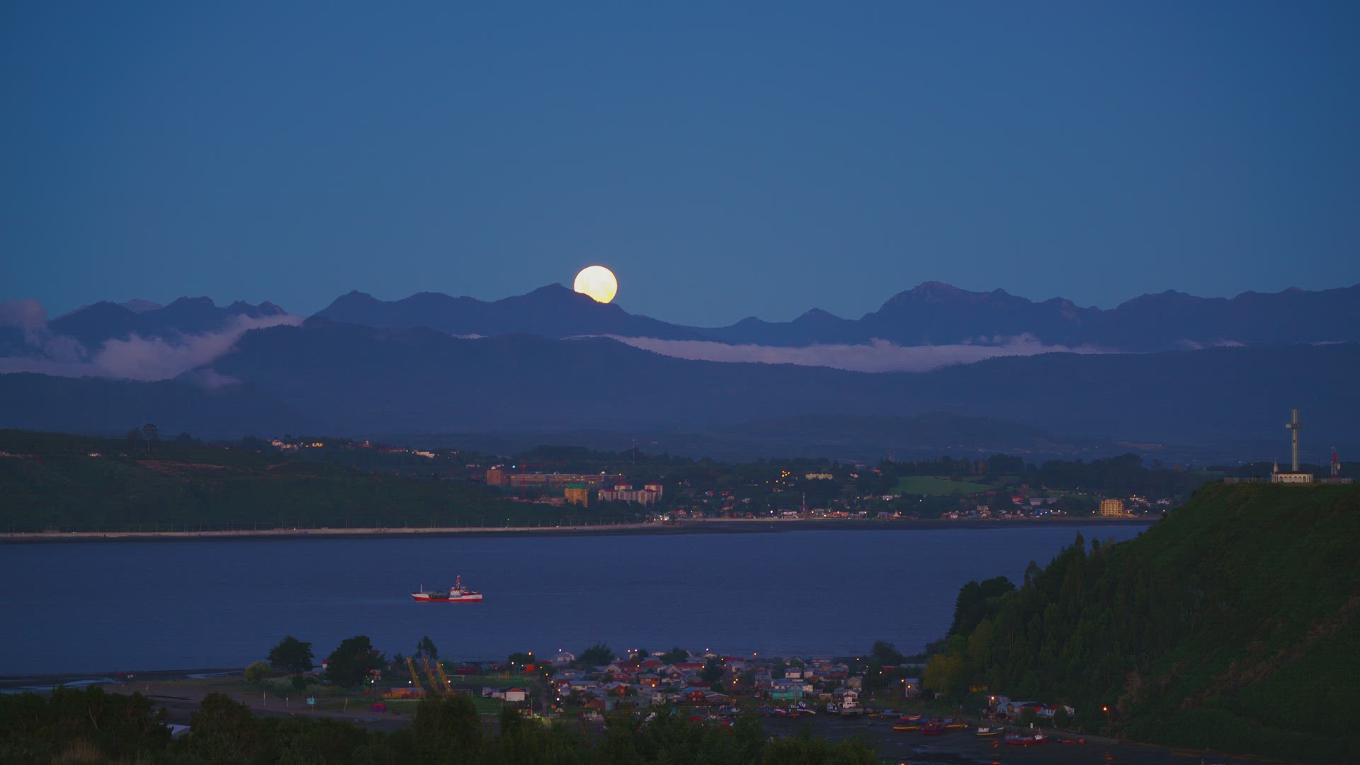 Time lapse looking over Puerto Montt, showing the full moon rising.
