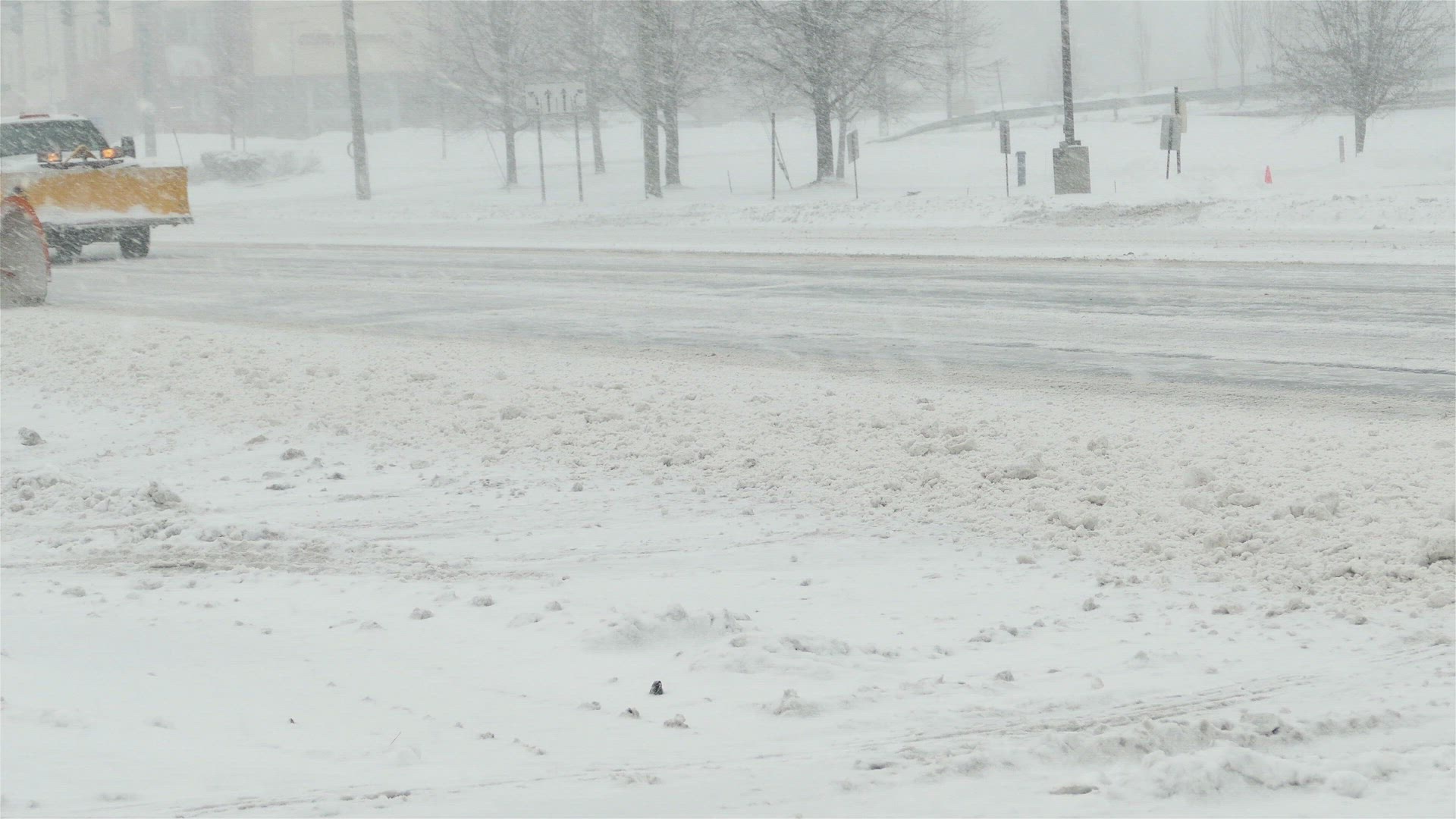Snow plowing on Post Road after winter blizzard