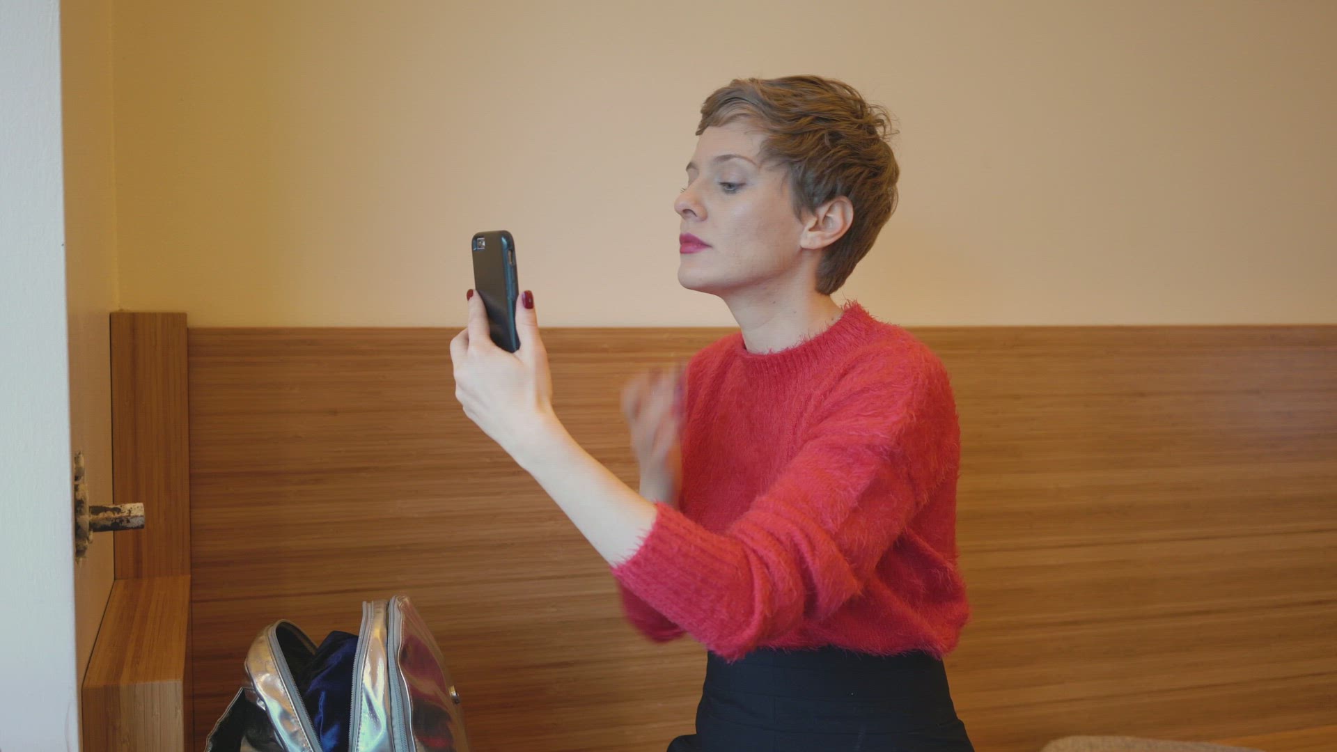 Woman applying make-up at home, Berlin, Germany