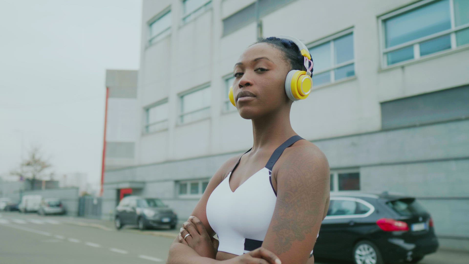 Portrait of young woman with headphones, Milan, Italy