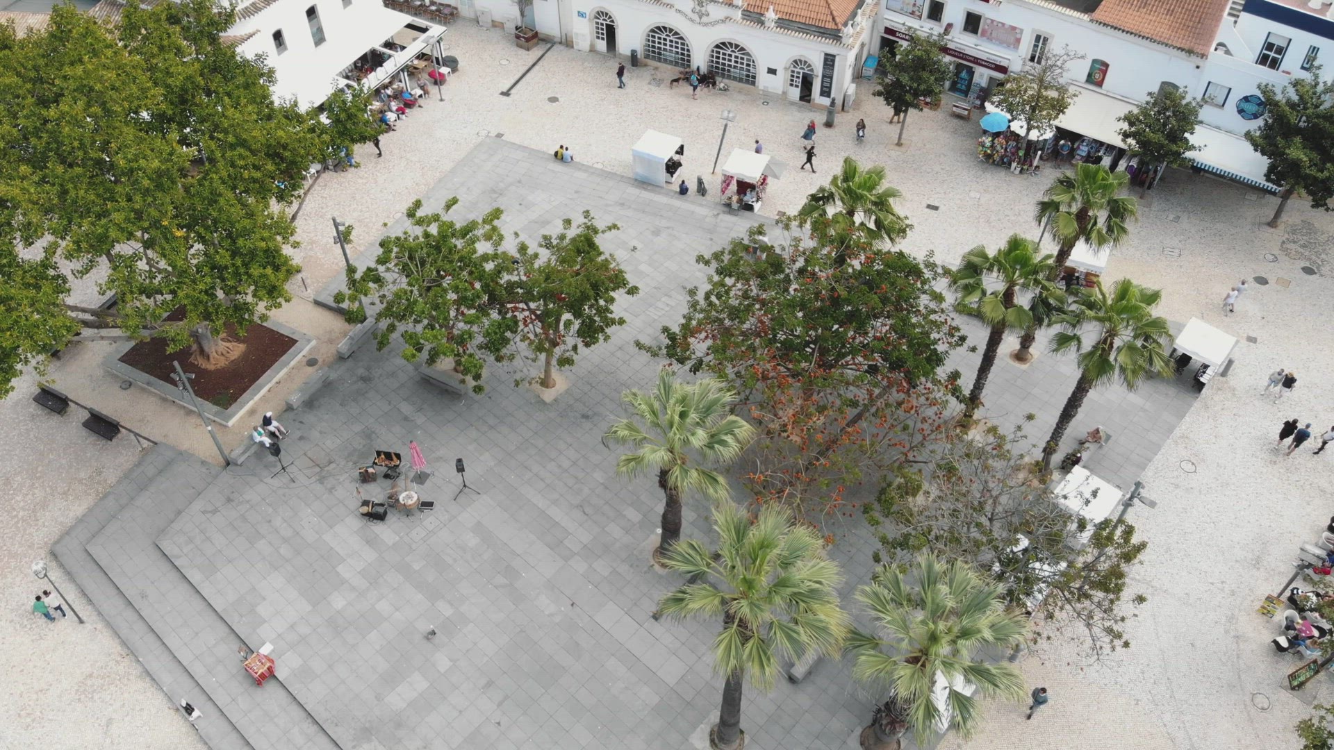 Historic Old town square near Pescadores beach in Albufeira, in Algarve, Portugal - Tilt up Reveal A