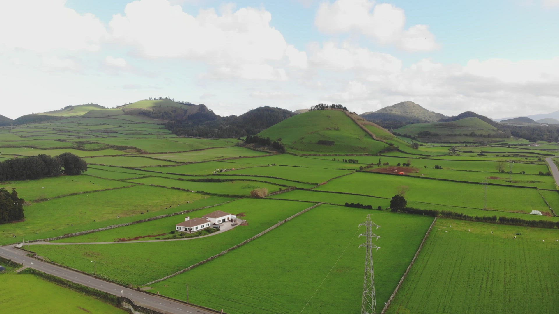 4k aerial drone footage panning the landscape of the beautifully luscious green farming fields of Po