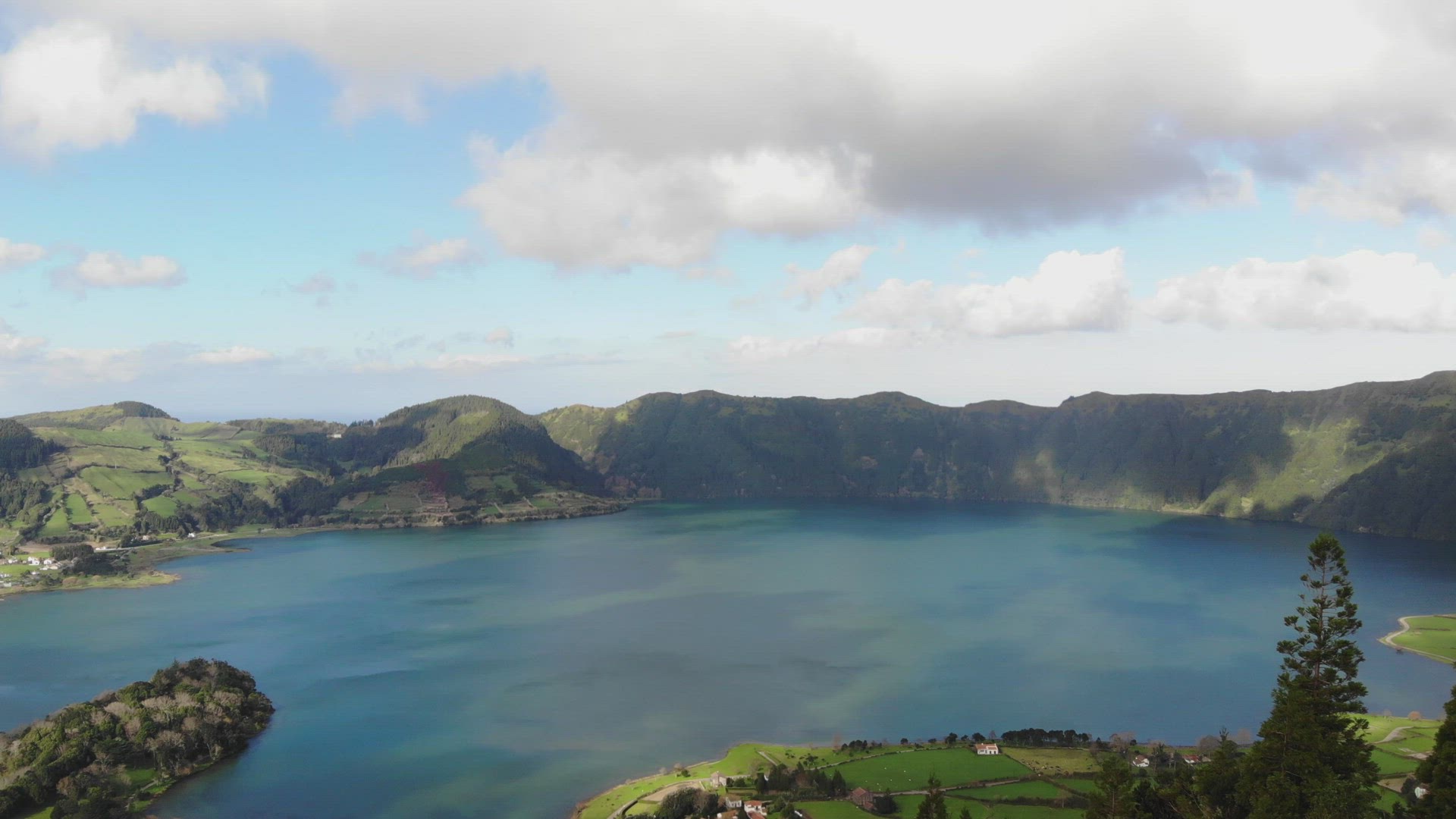 Panoramic view of Lagoa Azul (Blue Lake) in Sete cidades, Ponta Delgada, Azores - Fly forward aerial