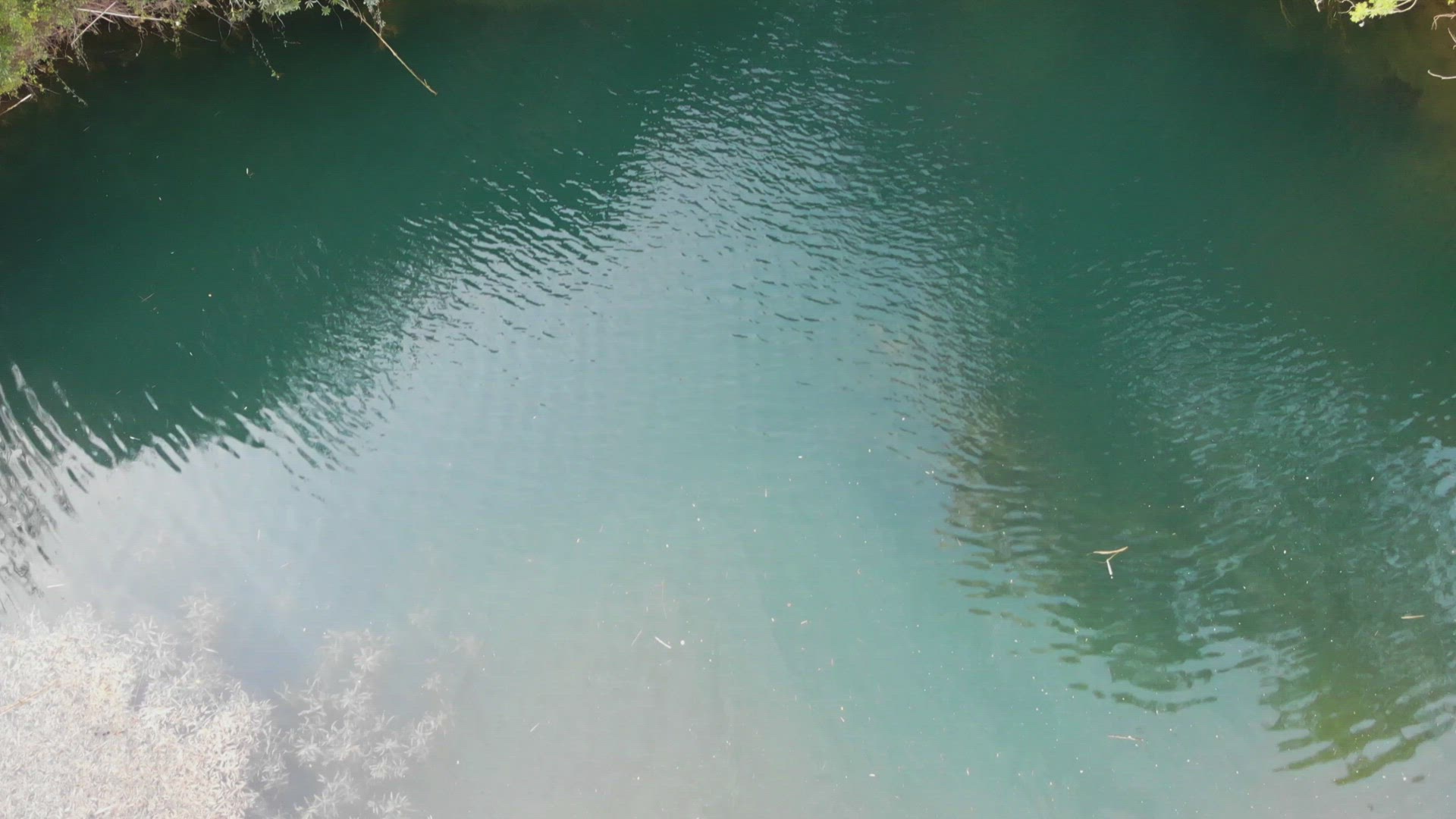 Reveal of Pego do Inferno waterfall in Santo Estevao, Algarve. Aerial tilt up 