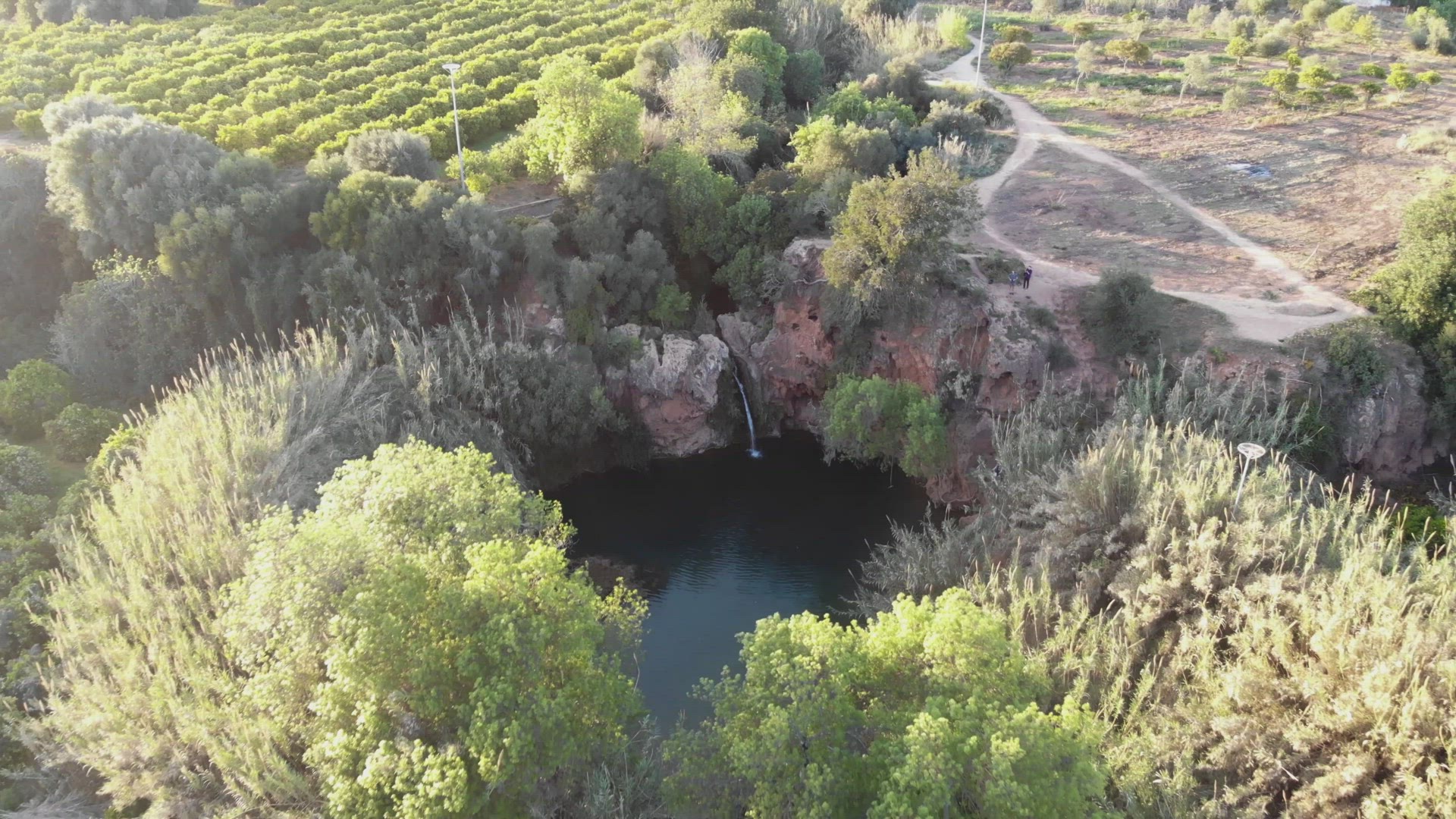 Aerial 4k footage of the landscape around the Pego Do Inferno waterfall in Portugal.
