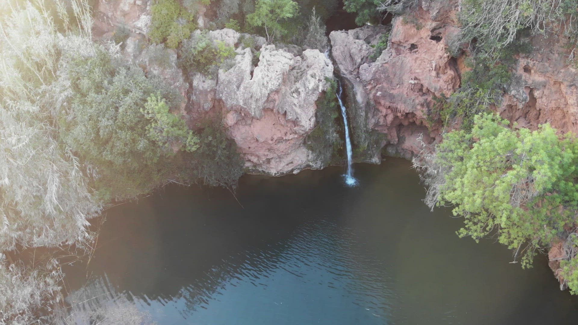 Pego do Inferno waterfall and turquoise lake in Tavira, Algarve, Portugal - Orbit Point of interest 