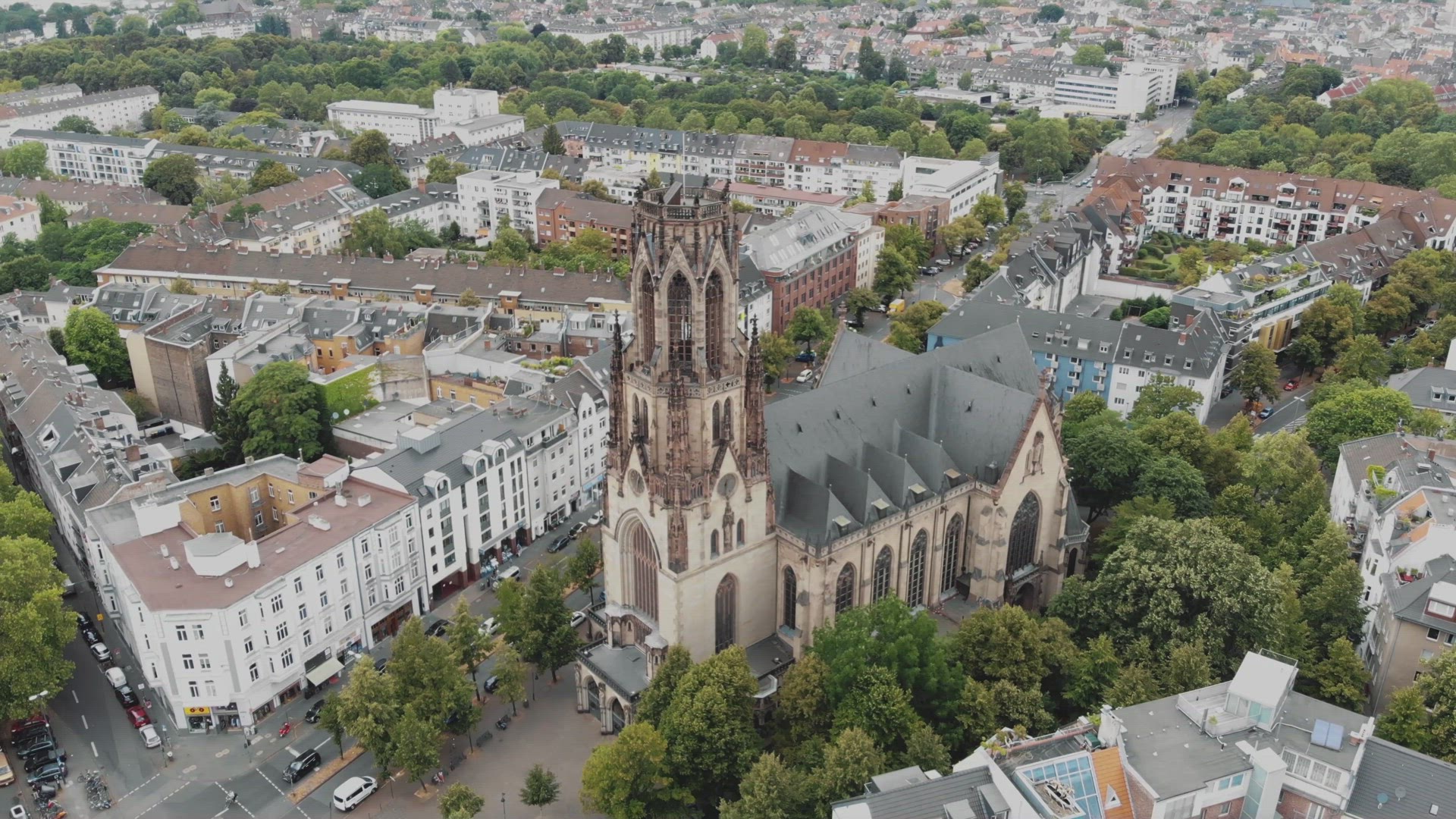 4k Aerial footage circling the historic Saint Martin Church building in Cologne, Germany.