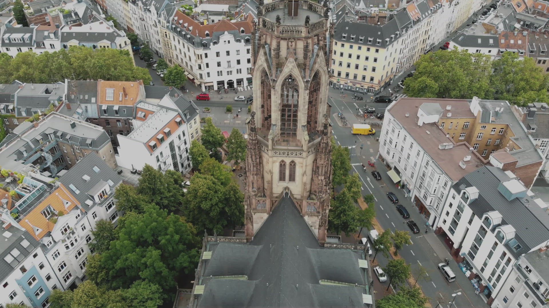 4k Aerial footage of the historic Saint Martin Church and surrounding area in Cologne, Germany.	