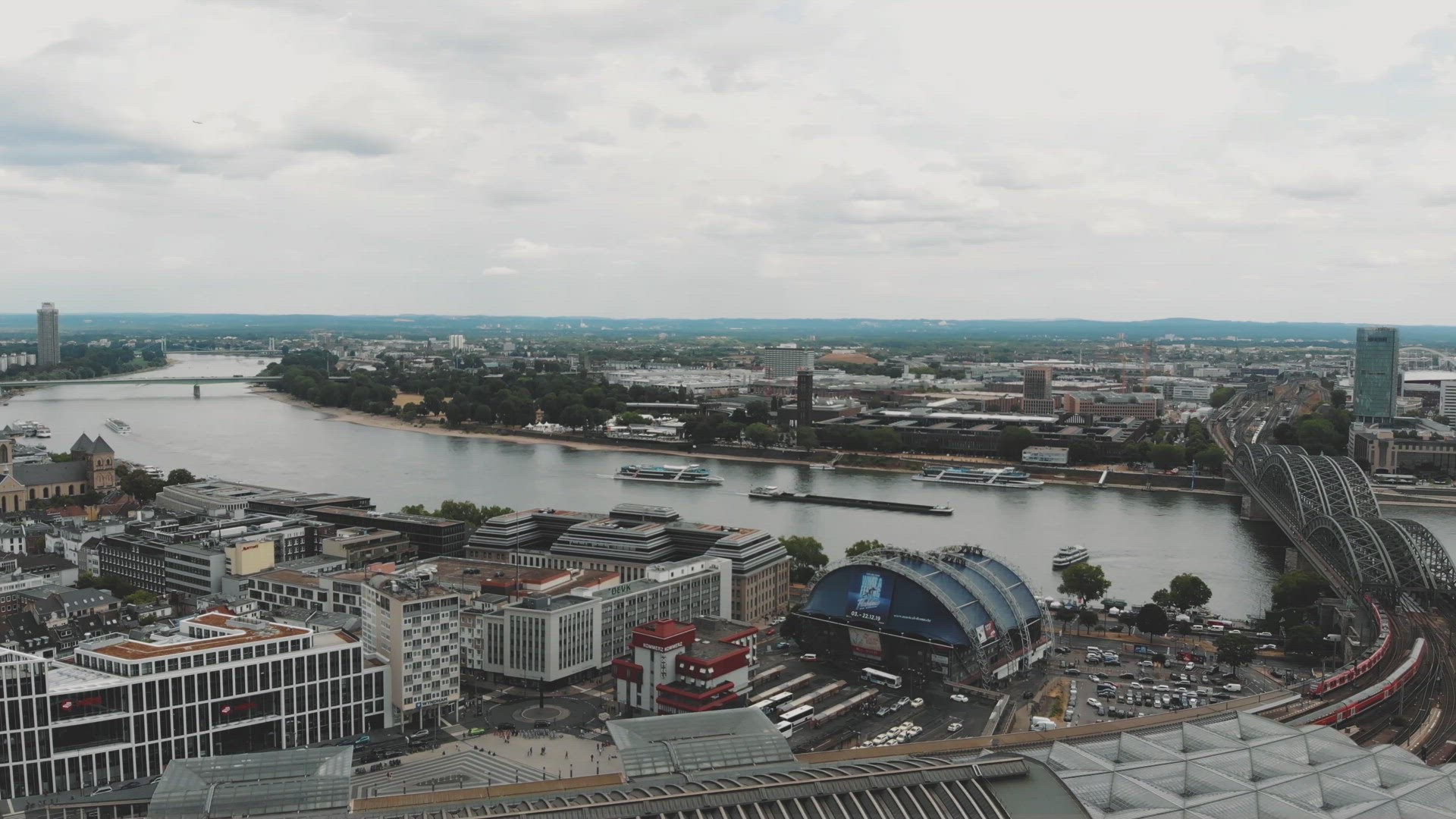 4k Panning aerial footage of the Hohenzollern Bridge crossing the Rhine River in historic Cologne, G