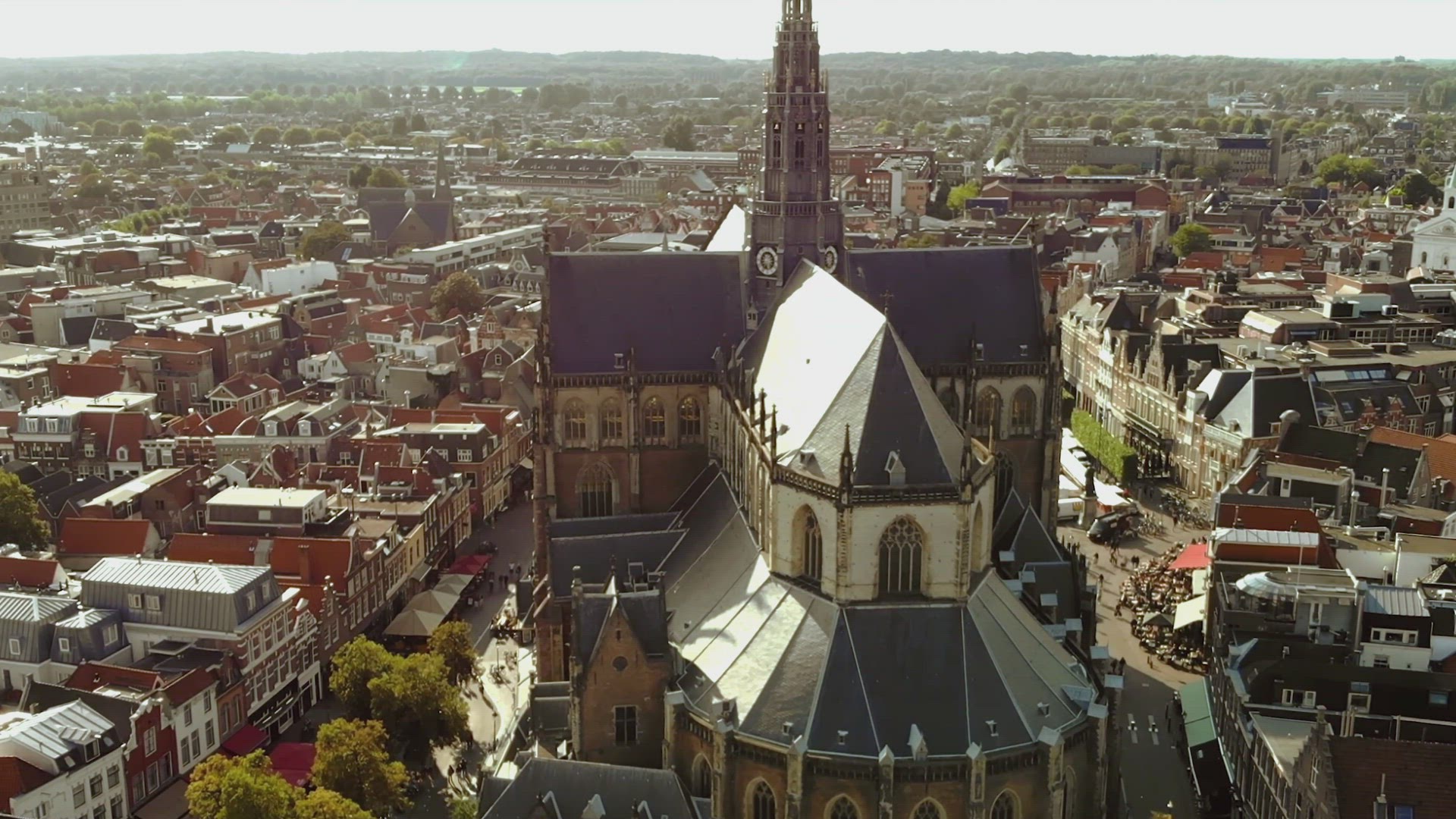 Church of Saint Bavo overlooking Haarlem Cityscape, Netherlands - Aerial	