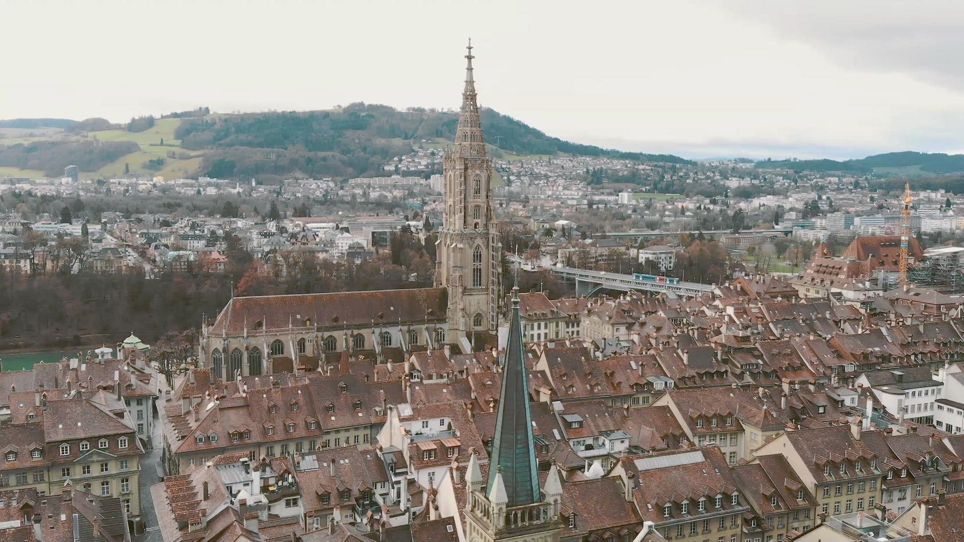 Bern Minster, Gothic Cathedral with single tower. Bern cityscape, Switzerland. Orbiting shot