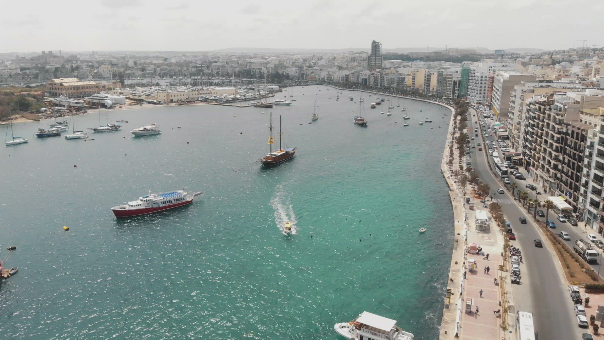 Aerial 4k drone footage of a harbor of the Mediterranean tourist resort town of Sliema, Malta.