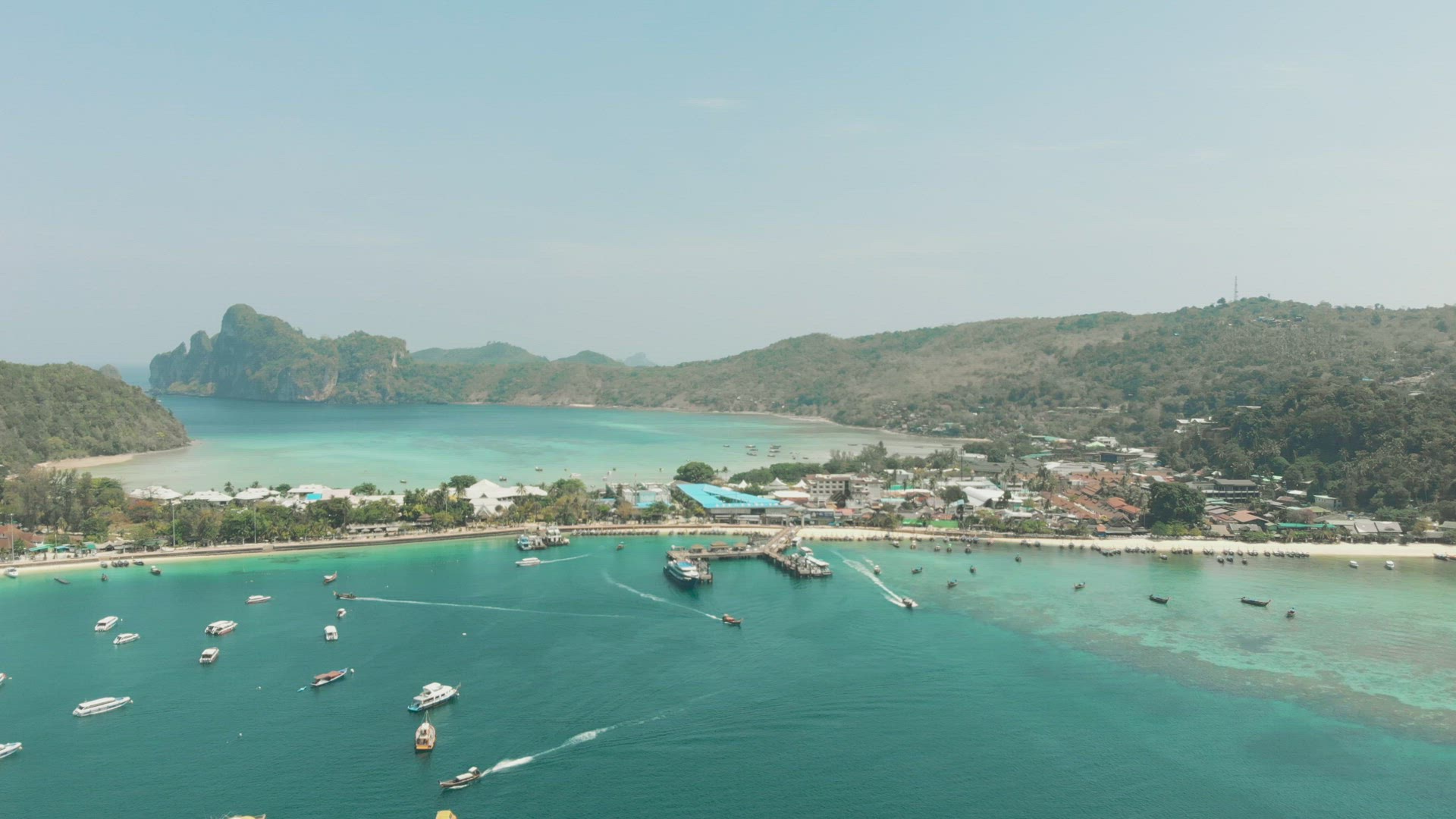 Top view of Ton Sai Pier busy boat traffic and Ton Sai Bay Paradise in Ko Phi Phi Don Island, Thaila