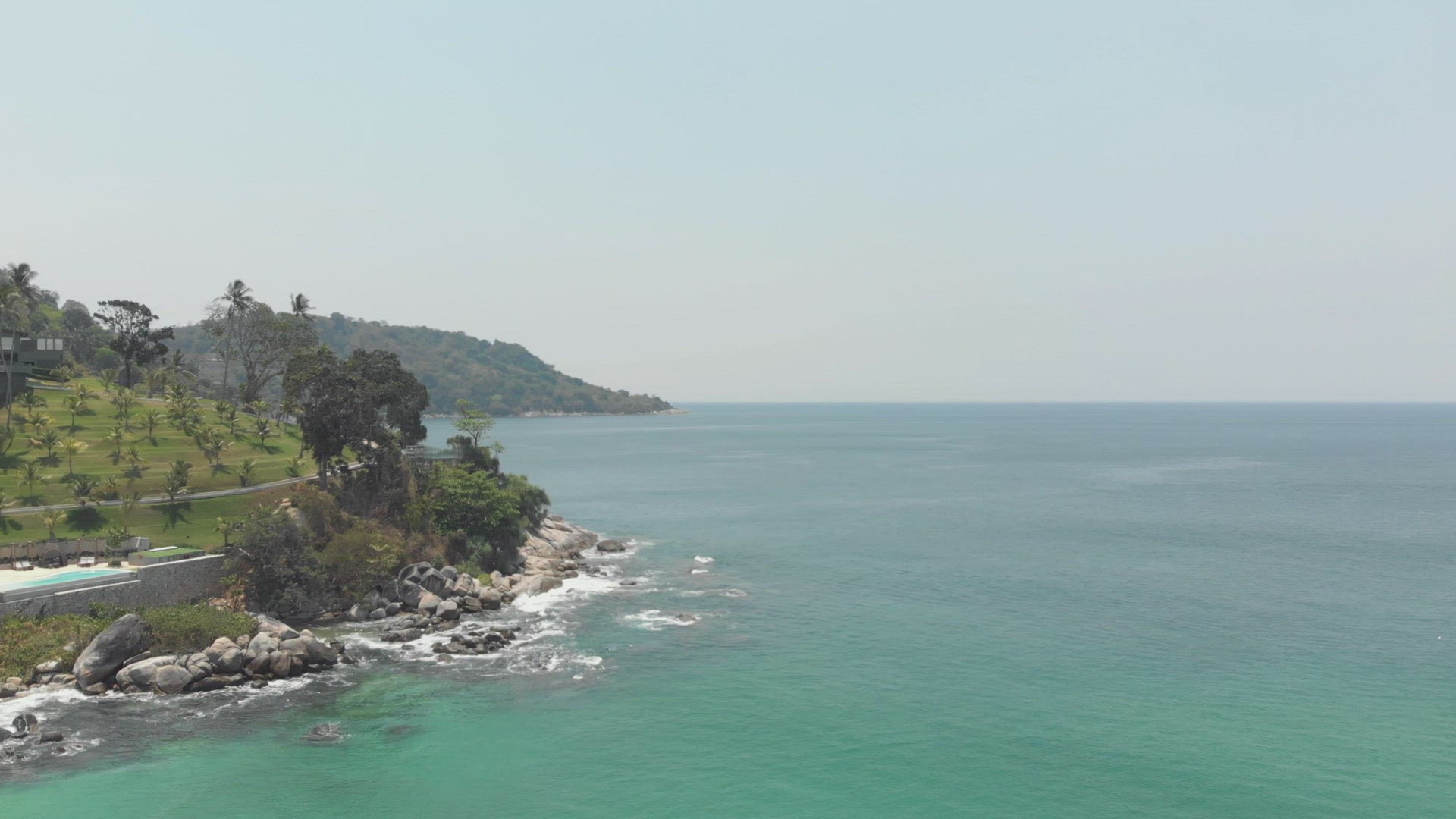 Pristine Andaman sea waves washing on Phuket coastline. Tropical vacations concept 