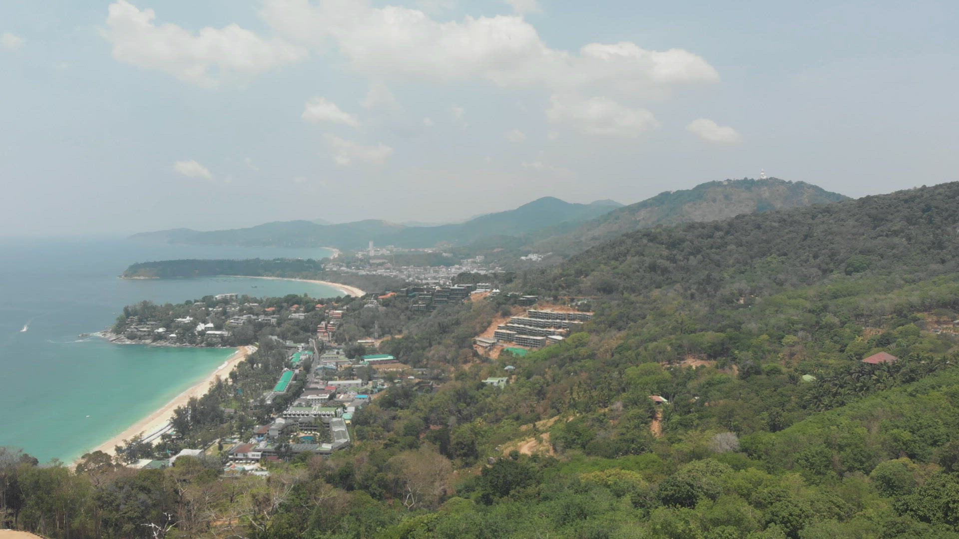 Panoramic view of Phuket coastline. Tropical beach and dense rainforest 