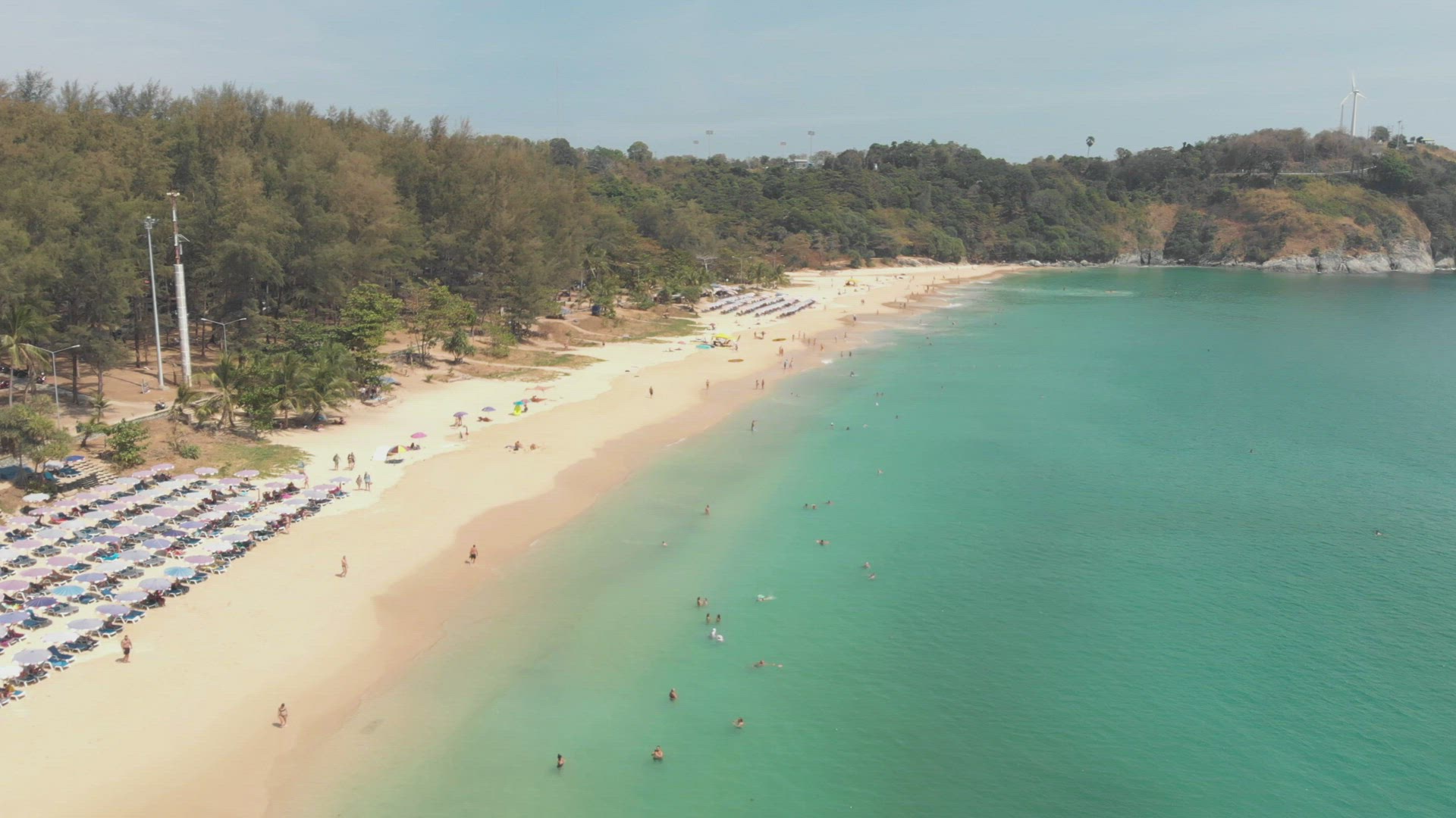 Idyllic Turquoise shoreline and paradisiac setting of Nai Harn Beach in southern Phuket, Thailand - 