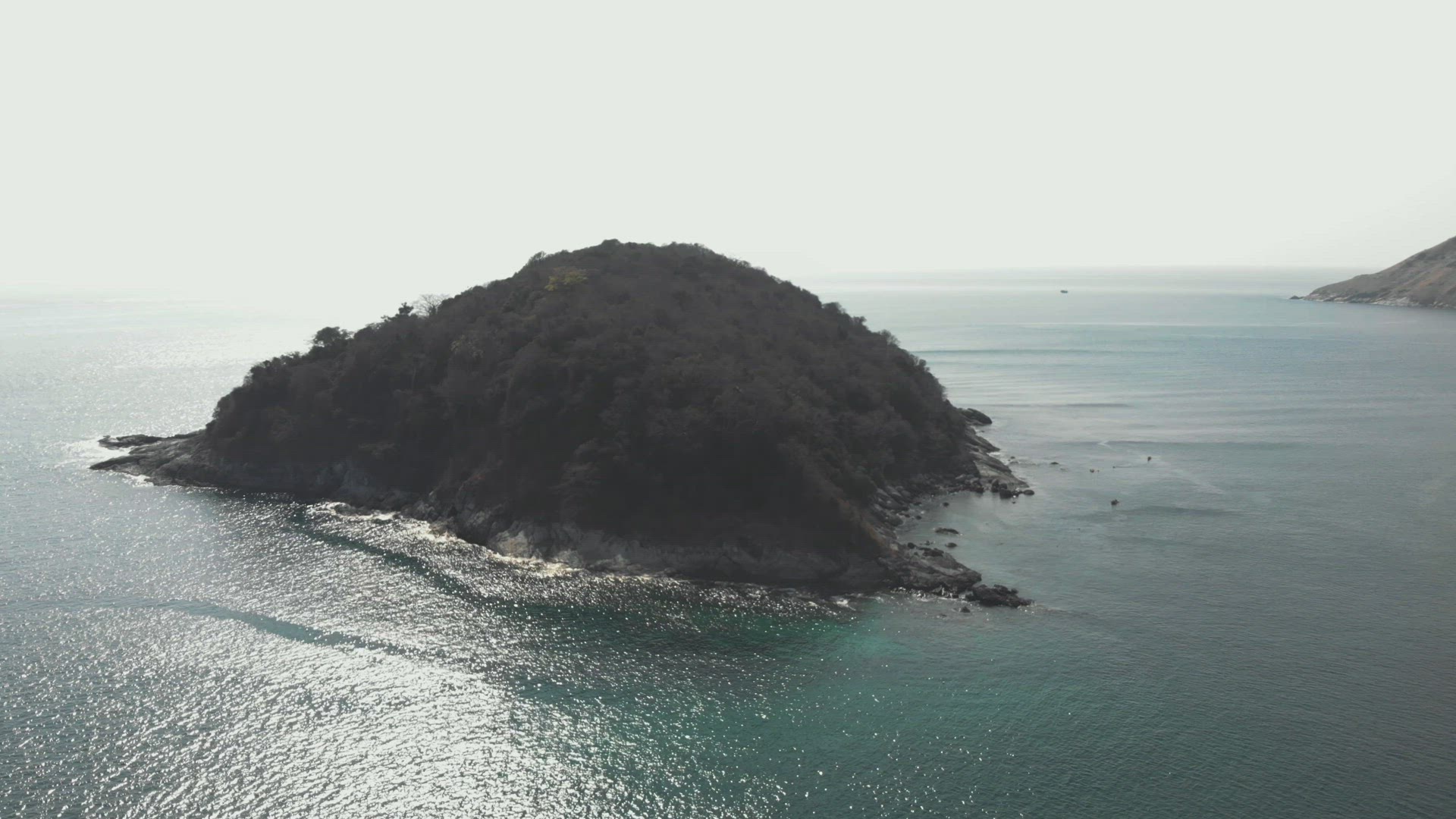 Islet off Phuket Island. Paradisiac Andaman Sea. Orbiting shot