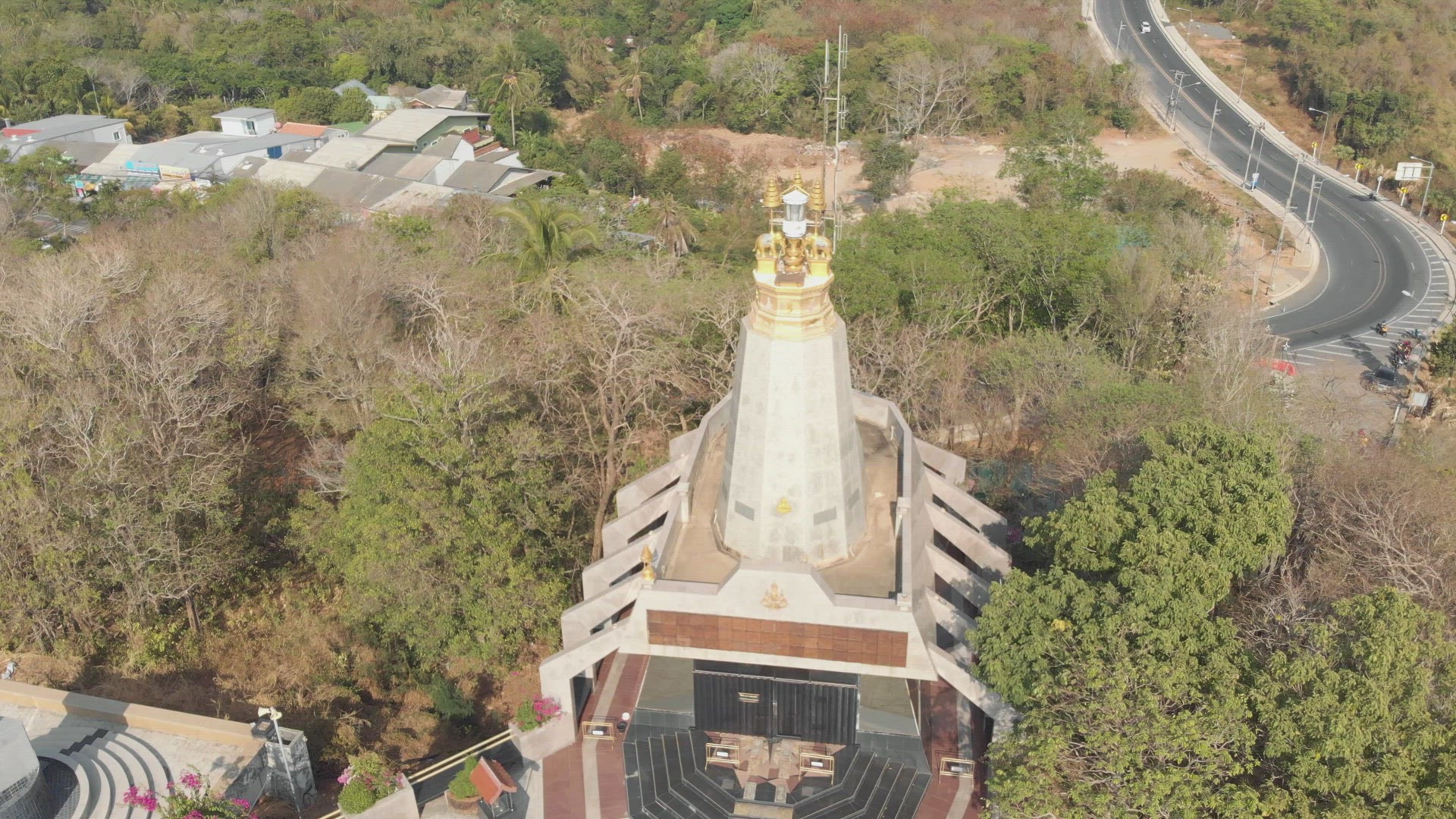 Orbiting shot of temple and meandering road, Phuket, Thailand