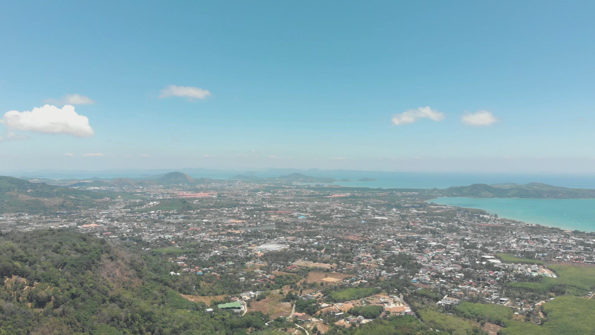 Top wide view over Mueang Phuket District urbanised tropical landscape in Phuket, Thailand - Aerial 