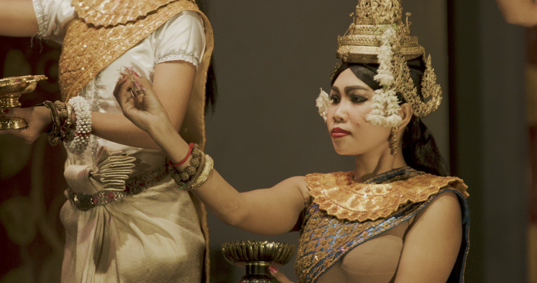 Cambodia Ballet dancers throwing flowers, long