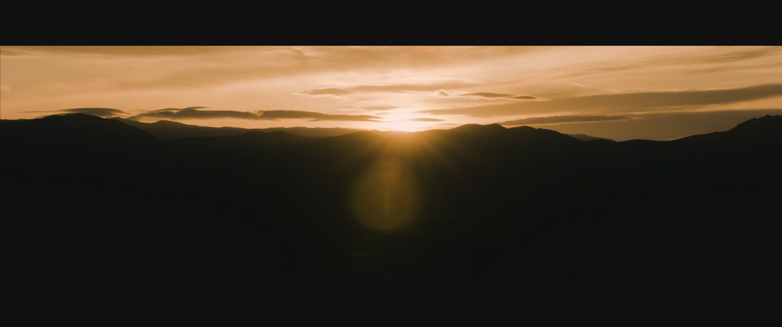 Sunrise over desert mountains