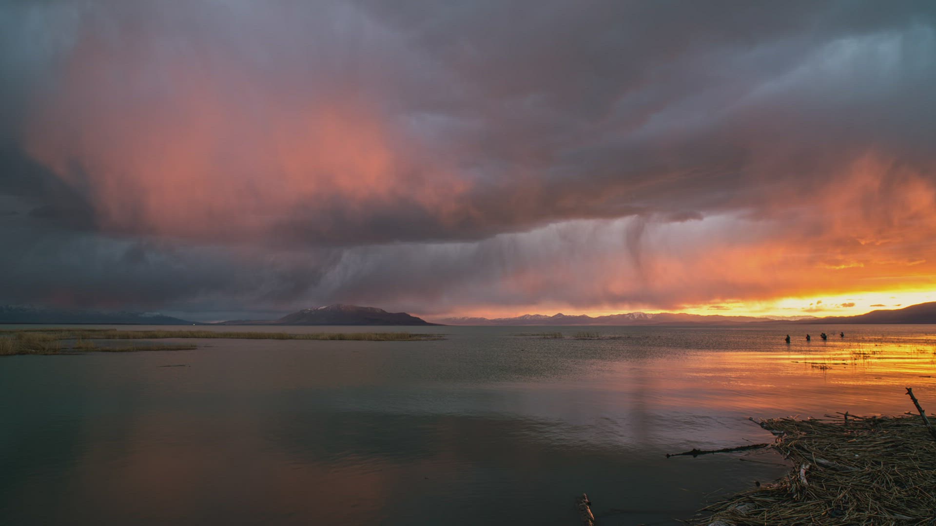 Time lapse of rain storm moving over Utah Lake with fishermen in the lake