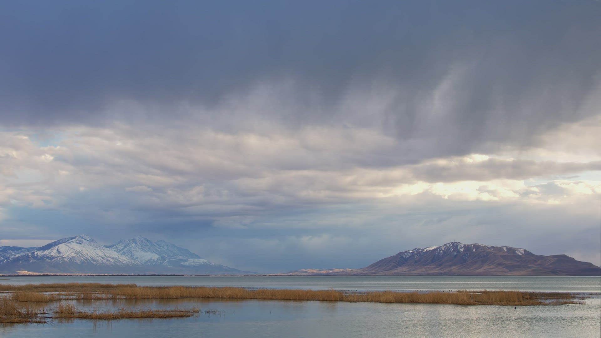 Rain storm rolling over Utah Lake in time lapse