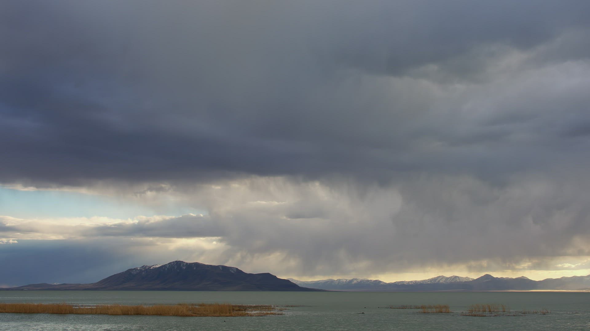 Storm clouds rolling through the sky over Utah Lake