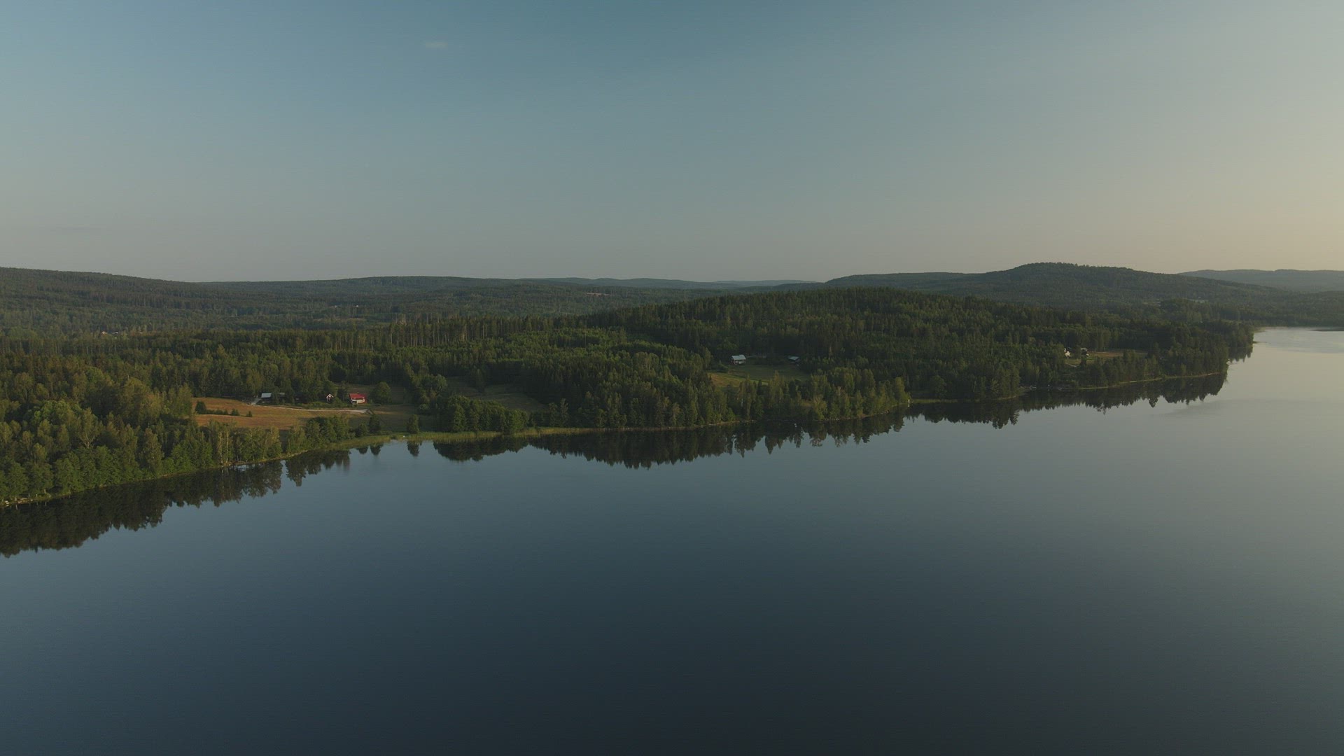 drone shot - view over mirror lake and islet