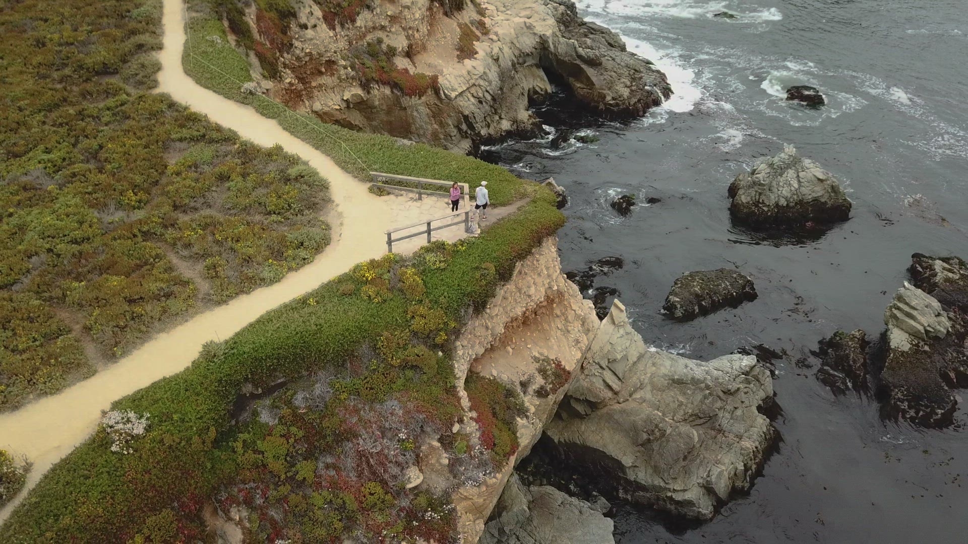Drone Circulating a man walking on the coast