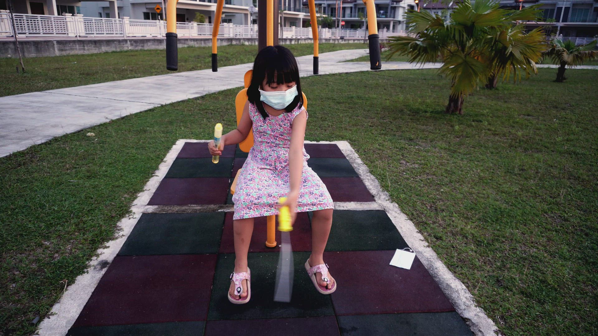 Little girl play bubble at park.