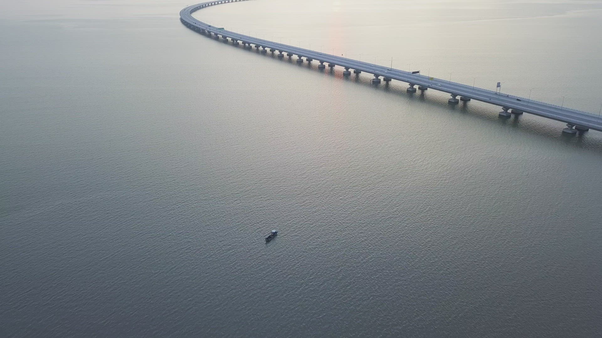 Aerial view fishing boat beside architecture Penang Second Bridge