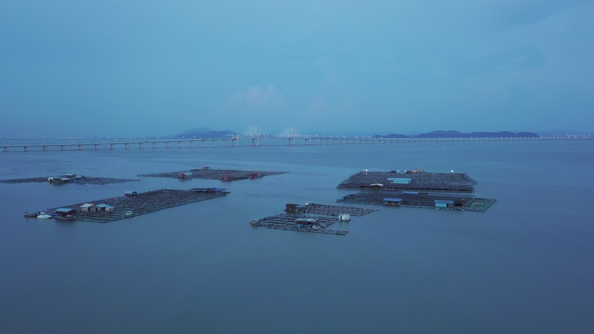 Aerial view fish farm in dusk hour. 